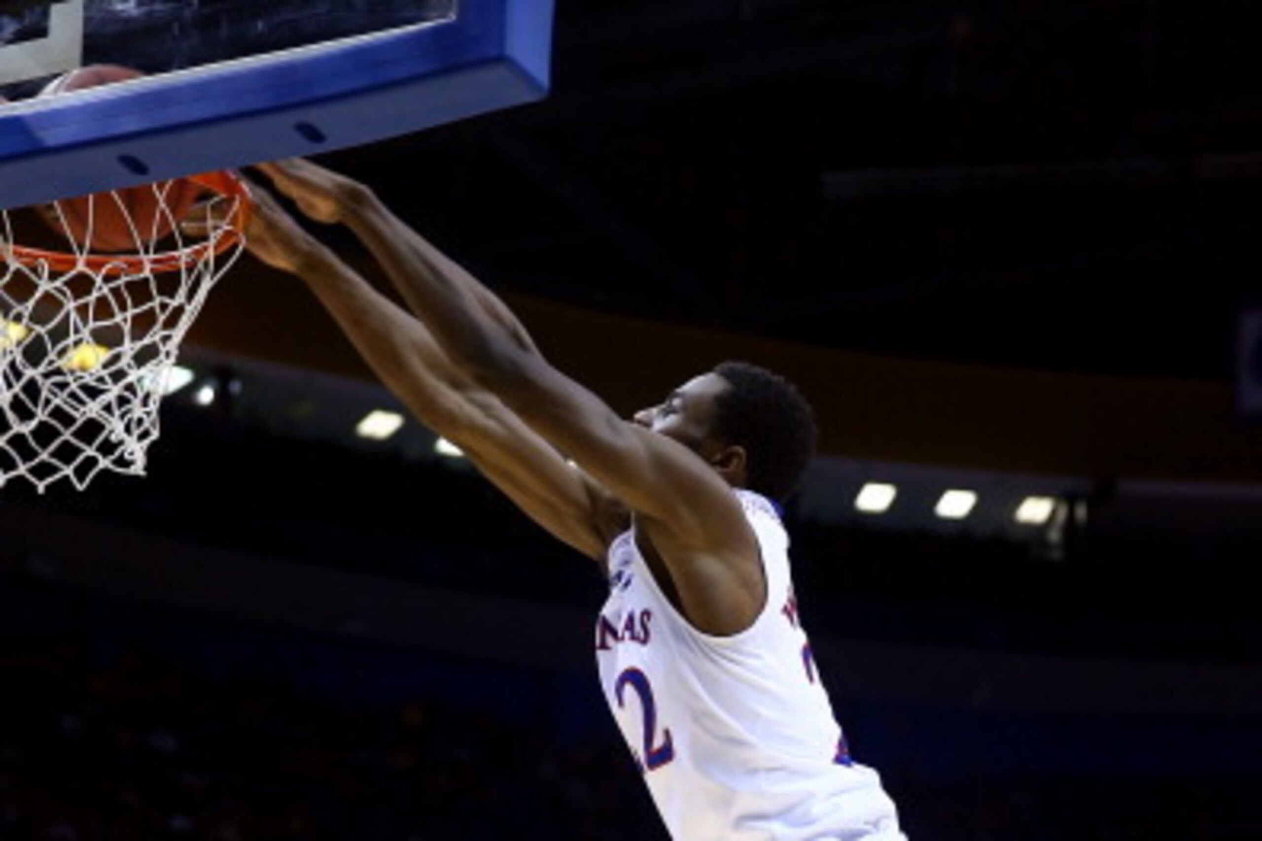 ST LOUIS, MO - MARCH 21:  Andrew Wiggins #22 of the Kansas Jayhawks dunks the ball against the Eastern Kentucky Colonels during the second round of the 2014 NCAA Men's Basketball Tournament at Scottrade Center on March 21, 2014 in St Louis, Missouri.  (Ph