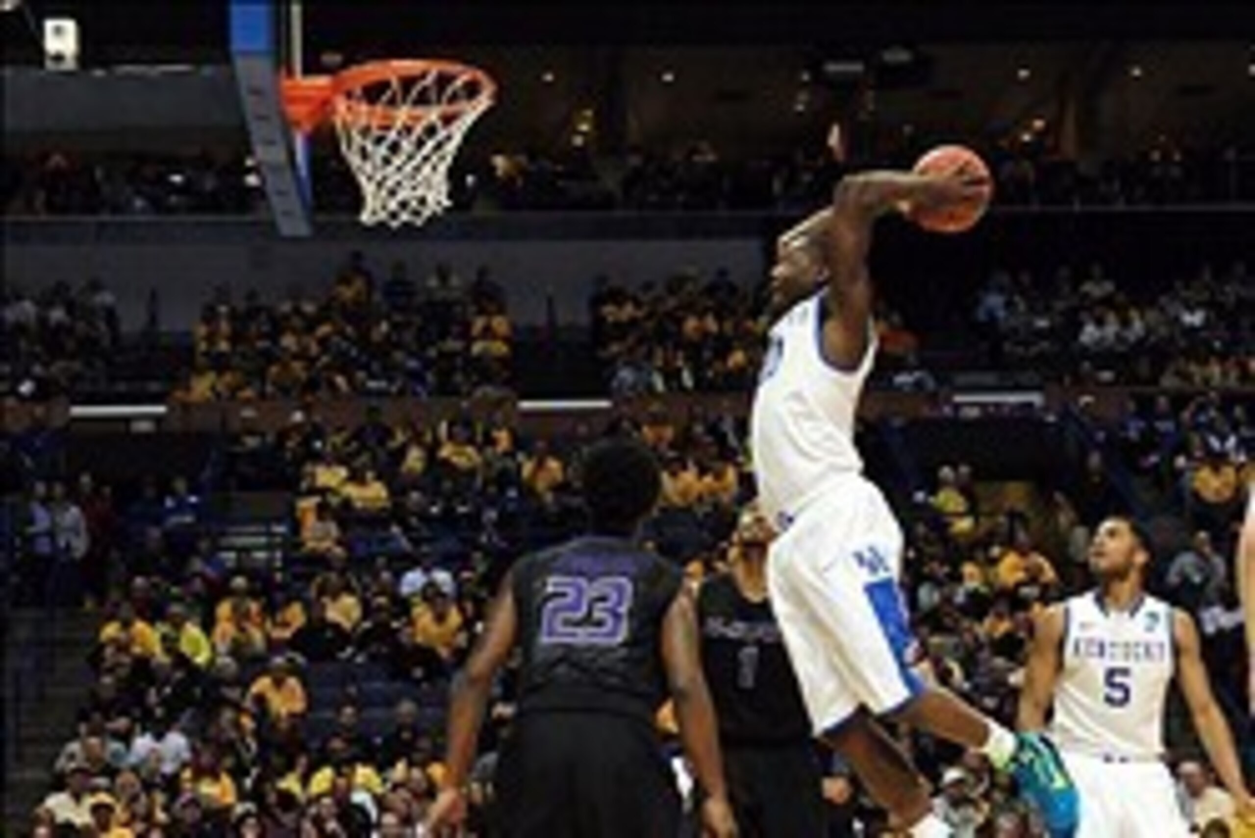 Mar 21, 2014; St. Louis, MO, USA; Kentucky Wildcats forward Julius Randle (30) dunks the ball past Kansas State Wildcats guard Nigel Johnson (23) in the first half during the 2nd round of the 2014 NCAA Men's Basketball Championship at Scottrade Center. Ma