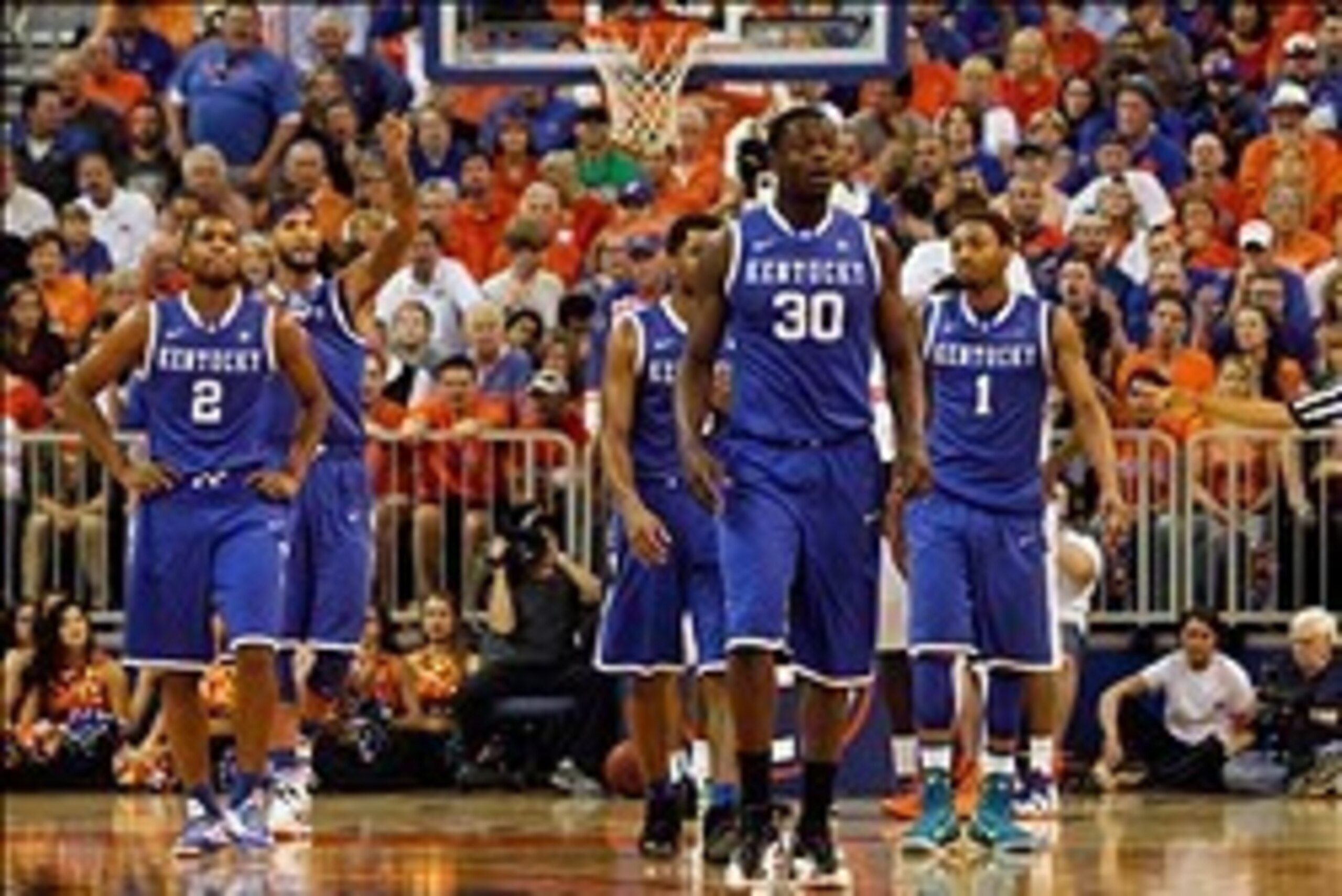 Mar 8, 2014; Gainesville, FL, USA; Kentucky Wildcats forward Julius Randle (30), guard/forward James Young (1),  forward Willie Cauley-Stein (15),  guard Aaron Harrison (2) and guard Andrew Harrison (5) look at the bench against the Tampa Bay Rays during 