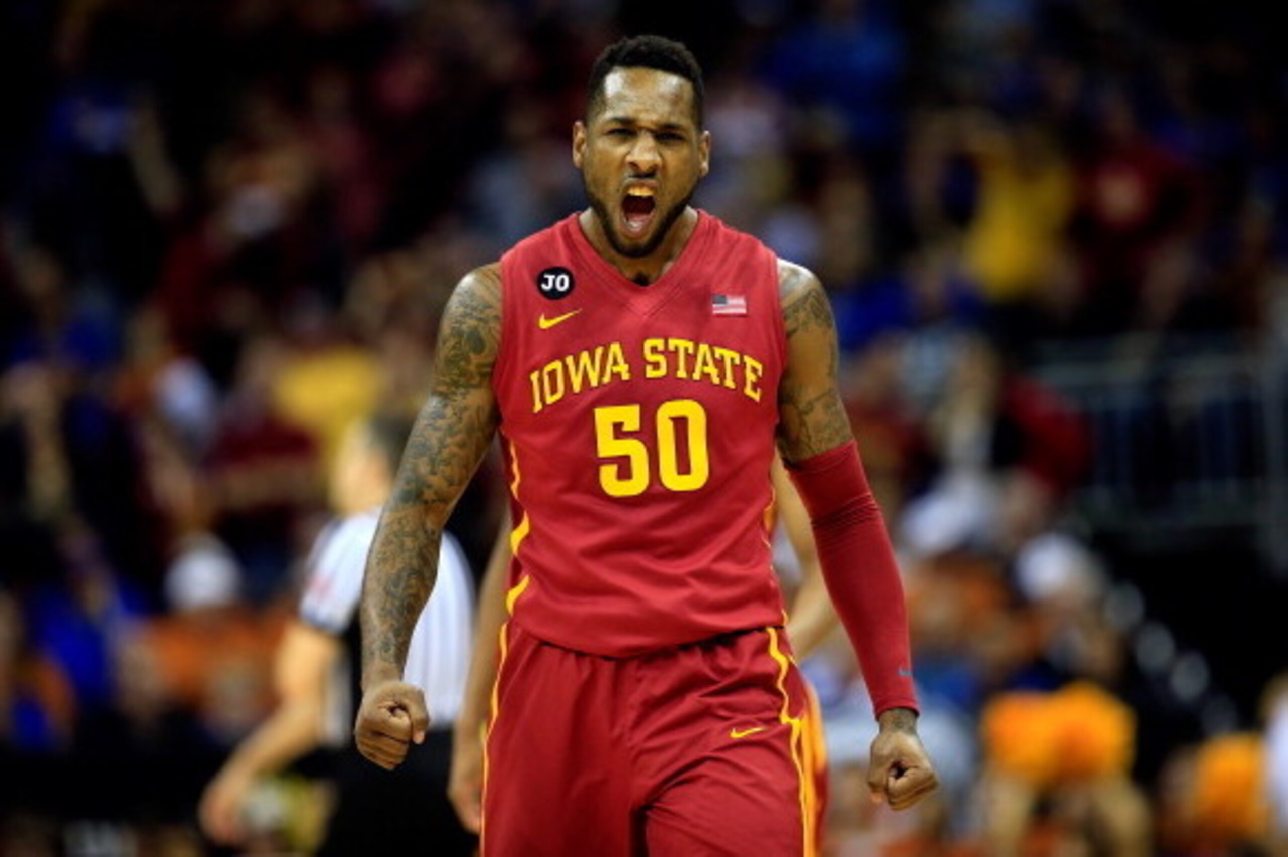 KANSAS CITY, MO - MARCH 14:  DeAndre Kane #50  of the Iowa State Cyclones celebrates as Iowa State Cyclones defeats Kansas Jayhawks 94-83 to win the Big 12 Basketball Tournament semifinal game at Sprint Center on March 14, 2014 in Kansas City, Missouri.  