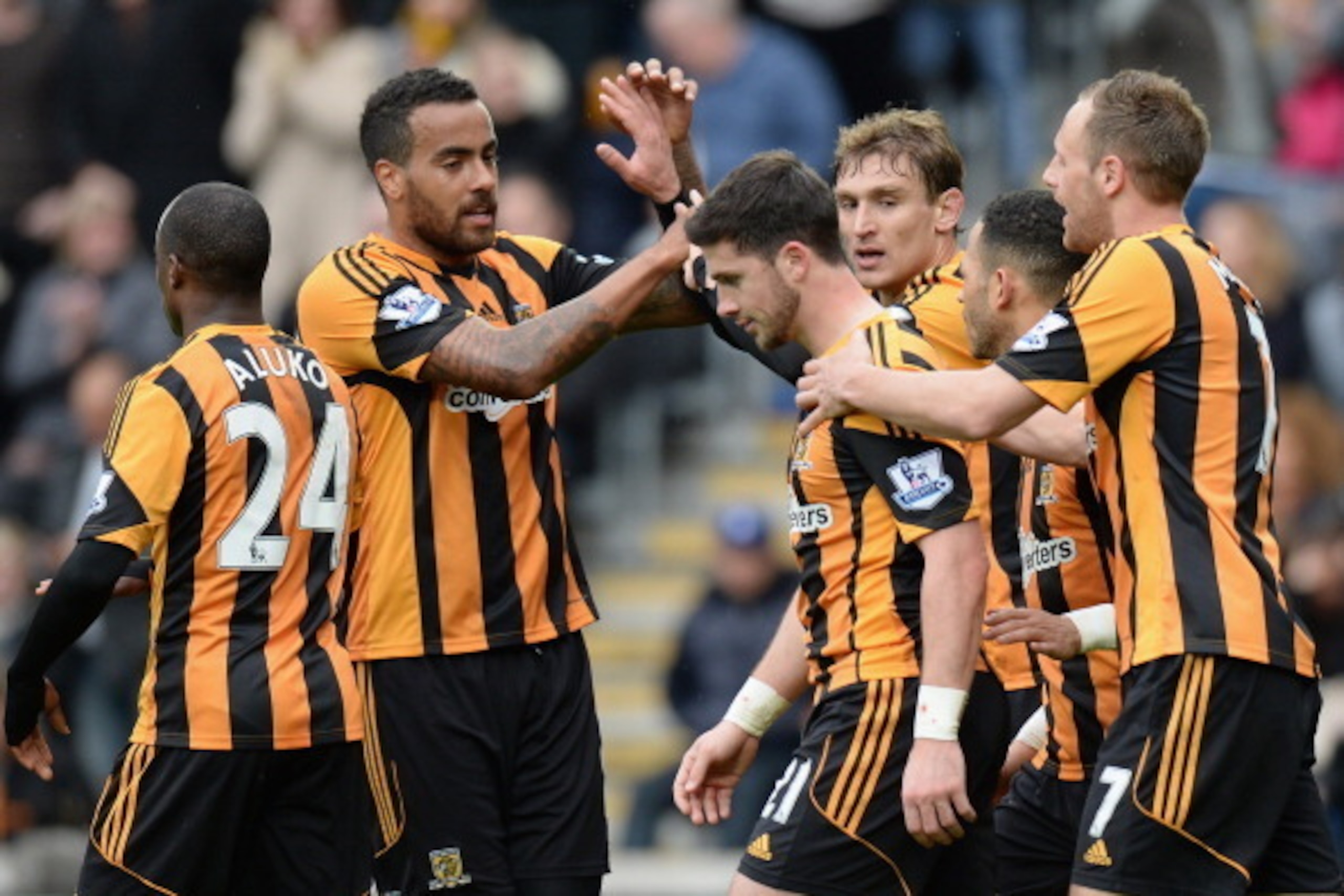 HULL, ENGLAND - MARCH 22:  Shane Long of Hull City is congratulated by his team-mates after scoring the second goal during the Barclays Premier League match between Hull City and West Bromwich Albion at the KC Stadium on March 22, 2014 in Hull, England.  