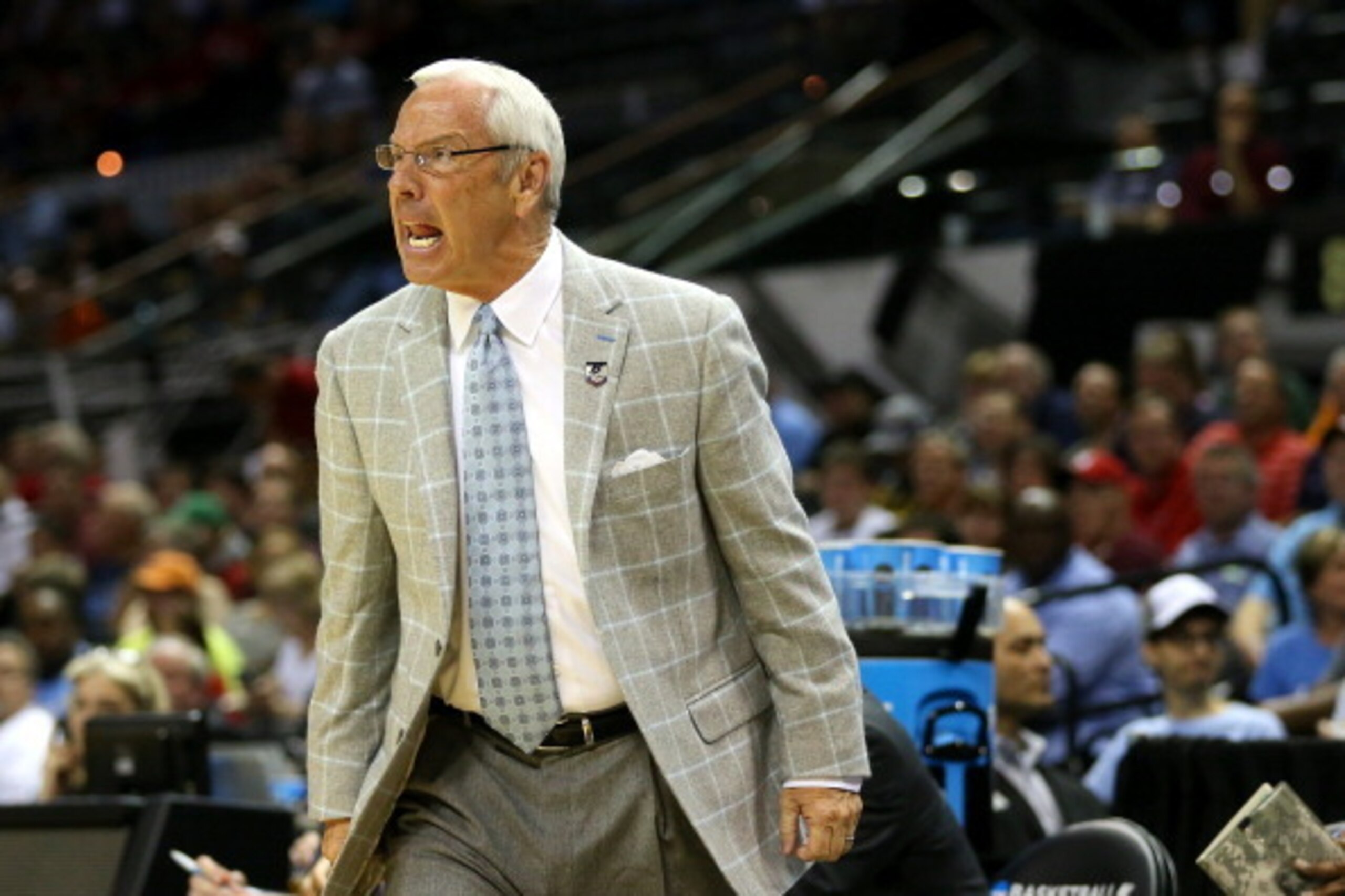 SAN ANTONIO, TX - MARCH 21: Head coach Roy Williams of the North Carolina Tar Heels yells from the bench during the first half against the Providence Friars in the second round of the 2014 NCAA Men's Basketball Tournament at AT&T Center on March 21, 2014 SAN ANTONIO, TX - MARCH 21: Head coach Roy Williams of the North Carolina Tar Heels yells from the bench during the first half against the Providence Friars in the second round of the 2014 NCAA Men's Basketball Tournament at AT&T Center on March 21, 2014