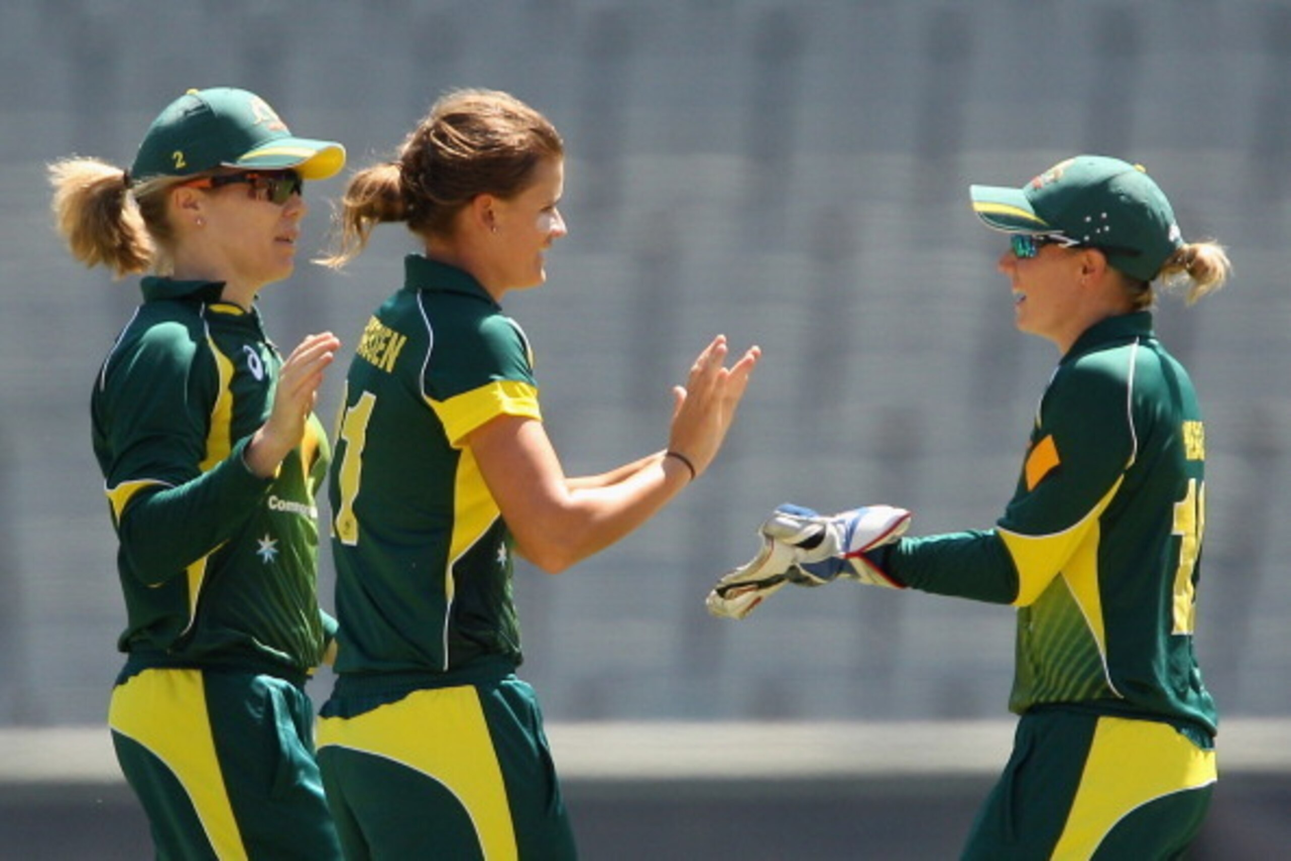MELBOURNE, AUSTRALIA - JANUARY 31:  Jess Jonassen of Australia celebrates the wicket of Natalie Sciver of England during game two of the International Twenty20 series between Australia and England at Melbourne Cricket Ground on January 31, 2014 in Melbour