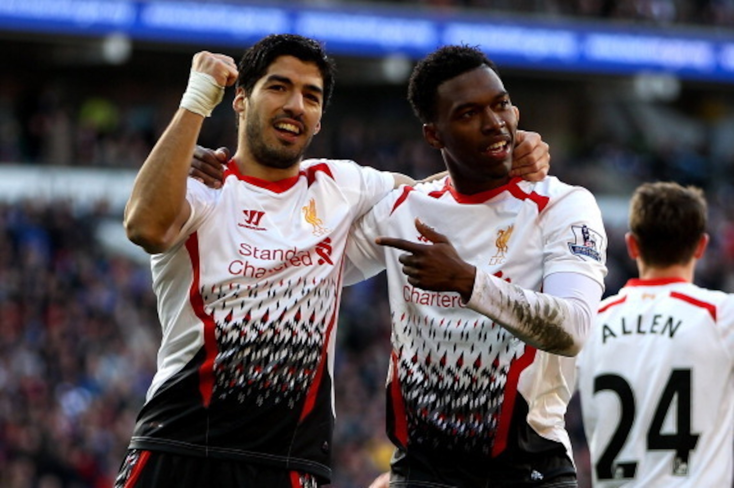 CARDIFF, WALES - MARCH 22:  Daniel Sturridge of Liverpool celebrates with team mate Luis Suarez after scoring his team's fifth goal during the Barclays Premier League match between Cardiff City and Liverpool at Cardiff City Stadium on March 22, 2014 in Ca