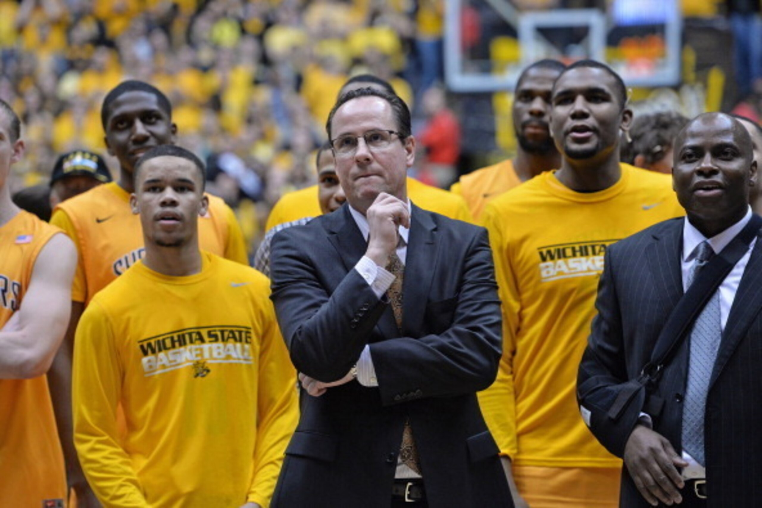 WICHITA, KS - FEBRUARY 22:  Head coach Gregg Marshall (C) of the Wichita State Shockers watches his team cut down the nets after beating the Drake Bulldogs to win the Missouri Valley Conference on February 22, 2014 at Charles Koch Arena in Wichita, Kansas