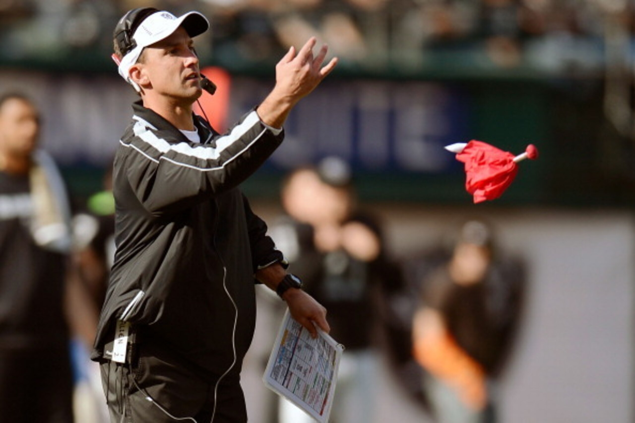 OAKLAND, CA - NOVEMBER 18: Head Coach Dennis Allen throws his red flag challenging a call during the first quarter of an NFL football game against the New Orleans Saints at O.co Coliseum on November 18, 2012 in Oakland, California. (Photo by Thearon W. He