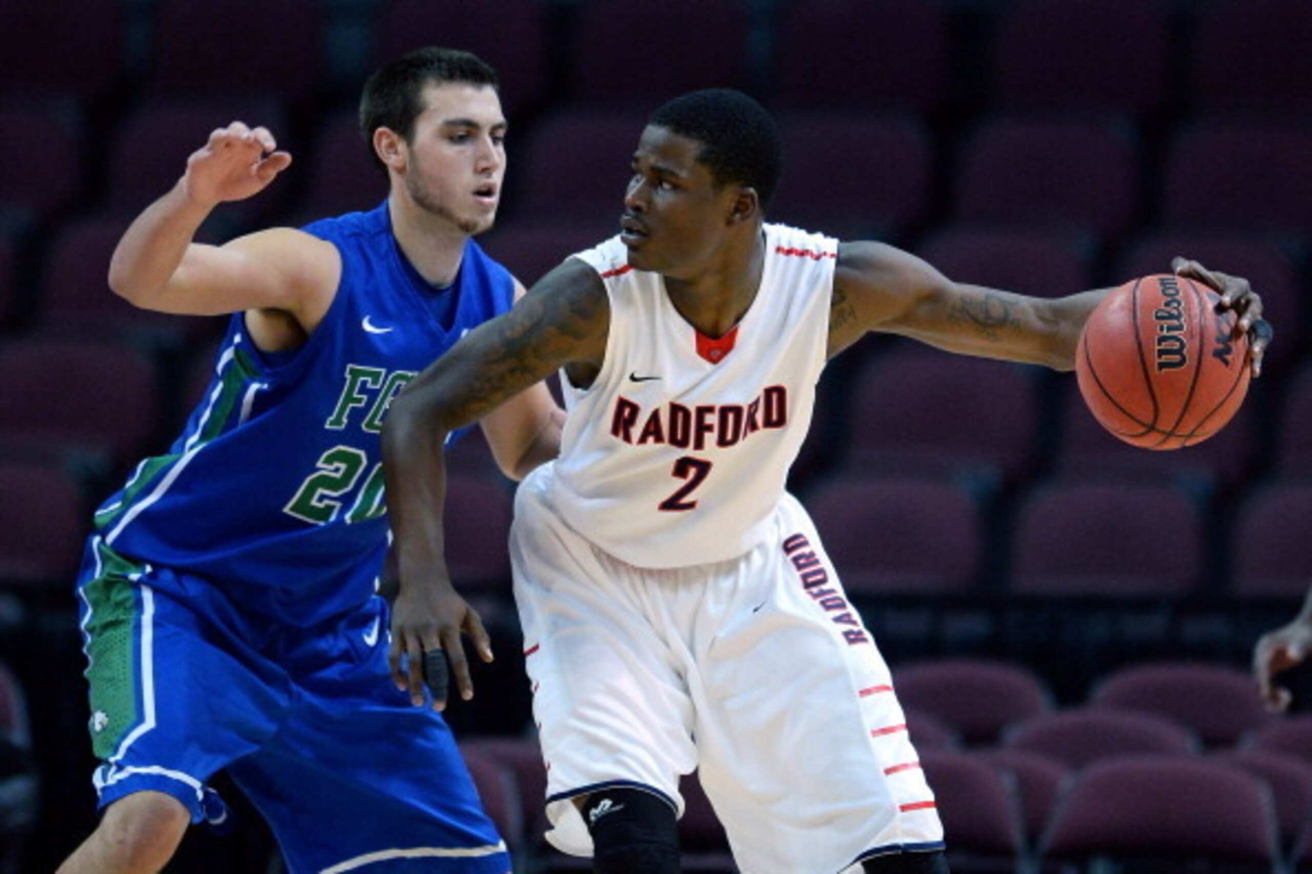 LAS VEGAS, NV - DECEMBER 23: Javonte Green #2 of the Radford Highlanders is guarded by Chase Fieler #20 of the Florida Gulf Coast Eagles during the 2013 Continental Tire Las Vegas Classic at the Orleans Arena on December 23, 2013 in Las Vegas, Nevada. Ra LAS VEGAS, NV - DECEMBER 23: Javonte Green #2 of the Radford Highlanders is guarded by Chase Fieler #20 of the Florida Gulf Coast Eagles during the 2013 Continental Tire Las Vegas Classic at the Orleans Arena on December 23, 2013 in Las Vegas, Nevada. Ra