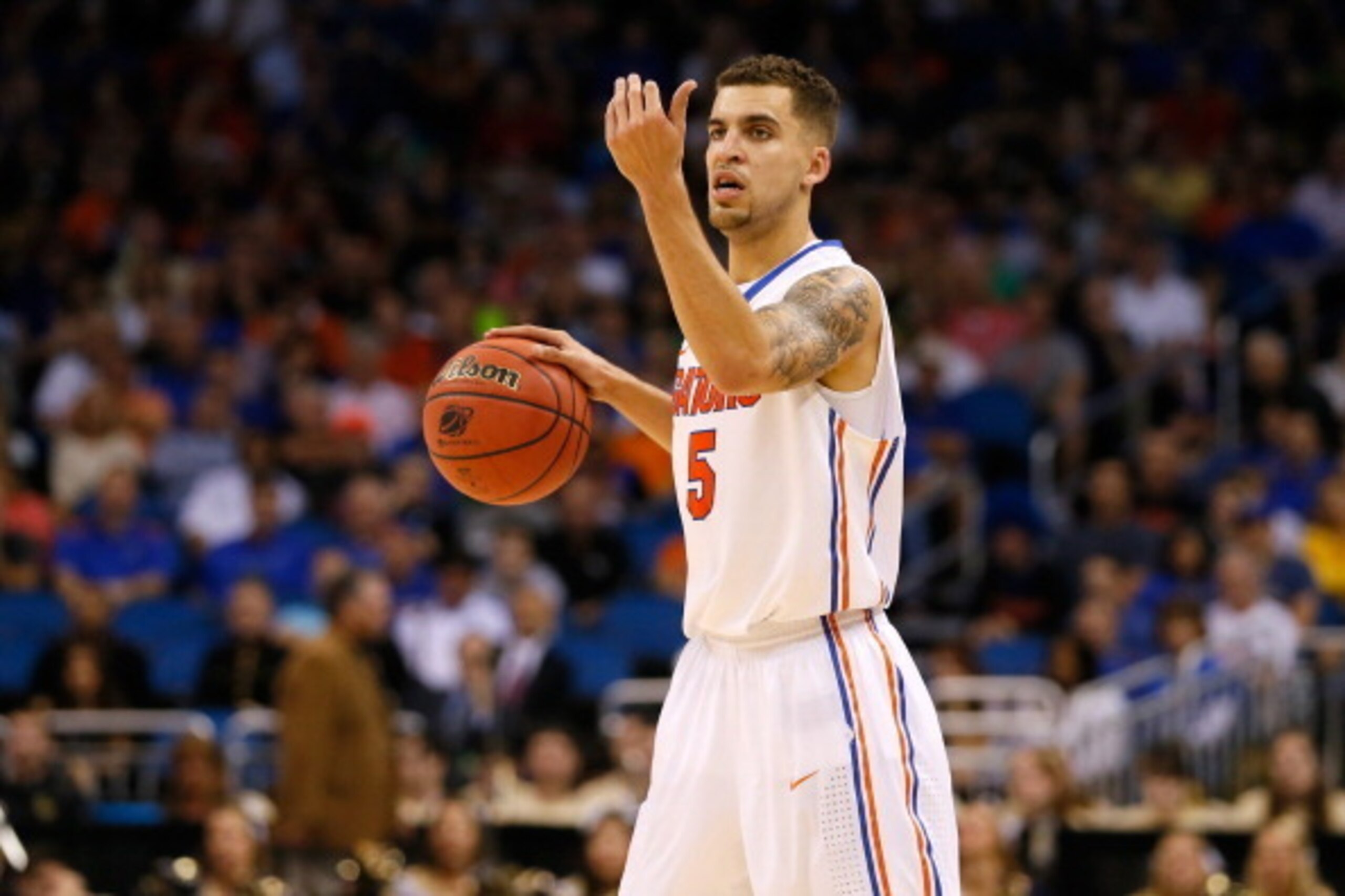 ORLANDO, FL - MARCH 22:  Scottie Wilbekin #5 of the Florida Gators calls a play in the second half while taking on the Pittsburgh Panthers during the third round of the 2014 NCAA Men's Basketball Tournament at Amway Center on March 22, 2014 in Orlando, Fl