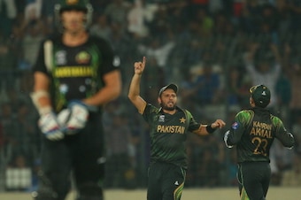 DHAKA, BANGLADESH - MARCH 23:  Shahid Afridi of Pakistan celebrates after running out Mitchell Starc (L) of Australia during the ICC World Twenty20 Bangladesh 2014 match between Australia and Pakistan at Sher-e-Bangla Mirpur Stadium on March 23, 2014 in D