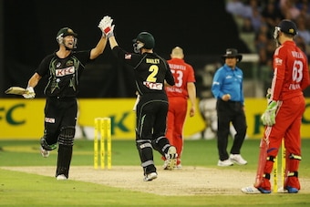 MELBOURNE, AUSTRALIA - JANUARY 31:  George Bailey (R) of Australia celebrates hitting the winning runs with Cameron White during game two of the International Twenty20 series between Australia and England at the Melbourne Cricket Ground on January 31, 201