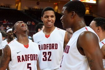 LAS VEGAS, NV - DECEMBER 23:  Rashun Davis #5, Juwan Wells #32 and Javonte Green #2 of the Radford Highlanders celebrate their 64-63 victory over the Florida Gulf Coast Eagles during the 2013 Continental Tire Las Vegas Classic at the Orleans Arena on Dece