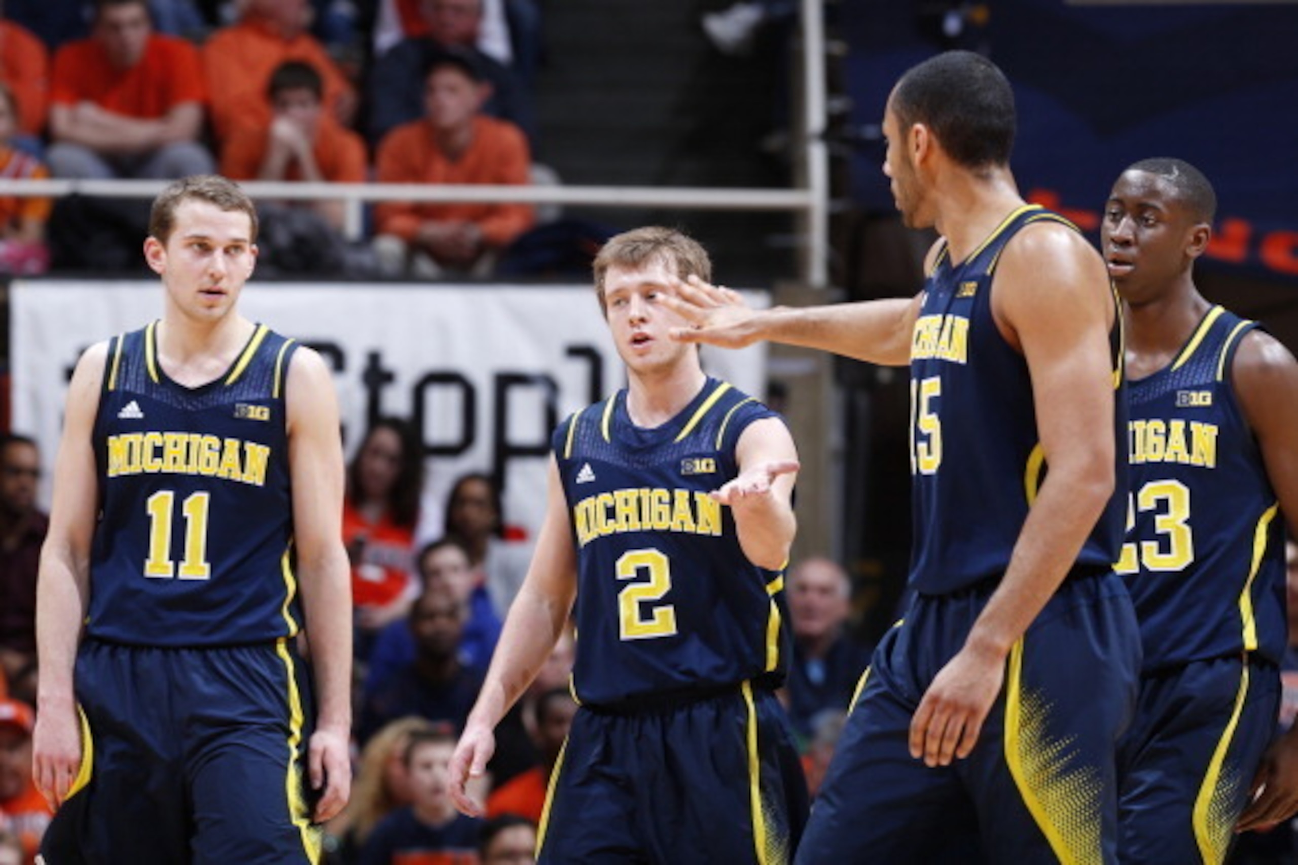 CHAMPAIGN, IL - MARCH 4:  Spike Albrecht #2, Jon Horford #15, Nik Stauskas #11 and Caris LeVert #23 of the Michigan Wolverines celebrate during the game against the Illinois Fighting Illini at State Farm Center on March 4, 2014 in Champaign, Illinois. Mic