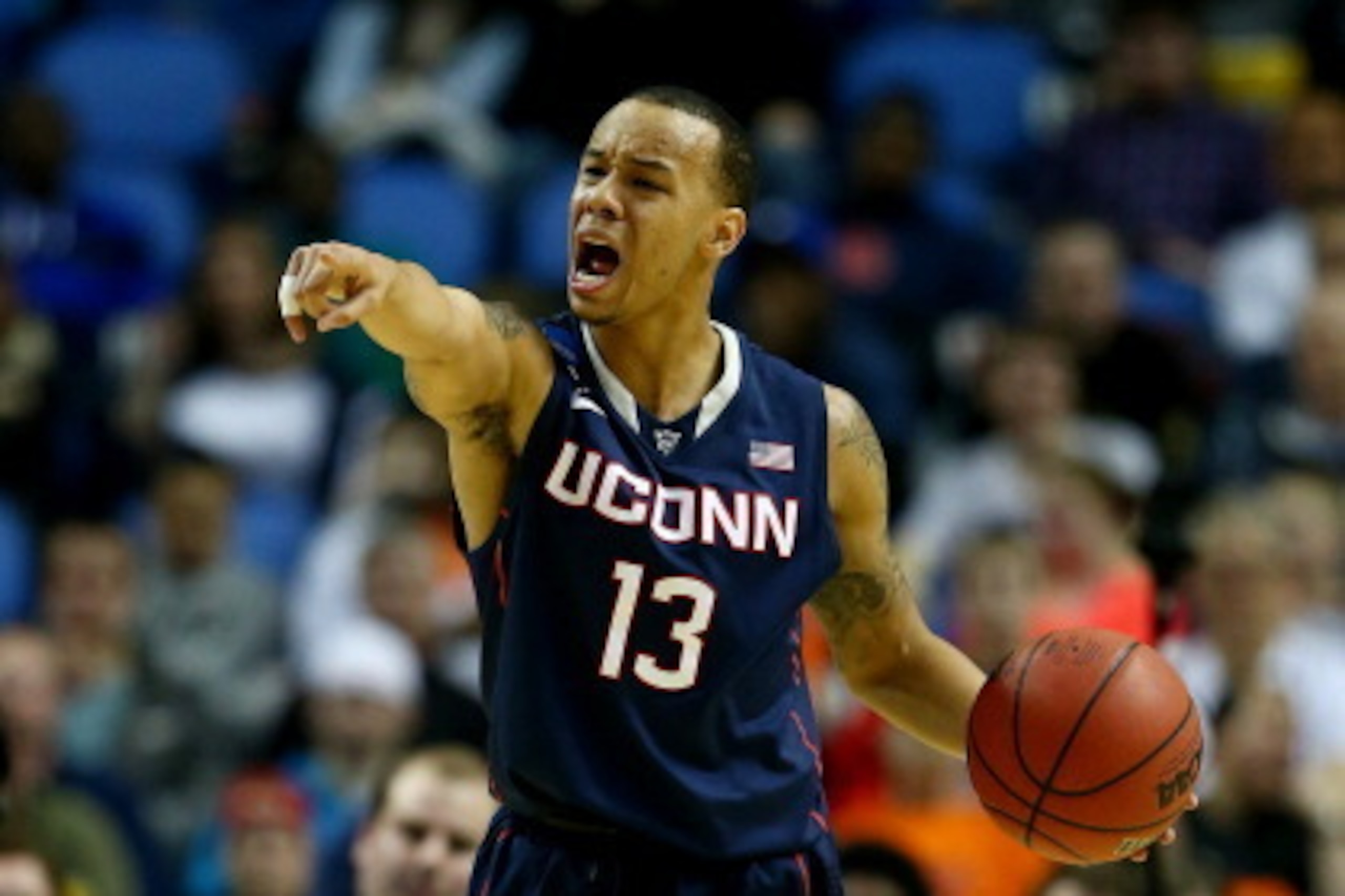 BUFFALO, NY - MARCH 22: Shabazz Napier #13 of the Connecticut Huskies calls a play against the Villanova Wildcats during the third round of the 2014 NCAA Men's Basketball Tournament at the First Niagara Center on March 22, 2014 in Buffalo, New York.  (Pho