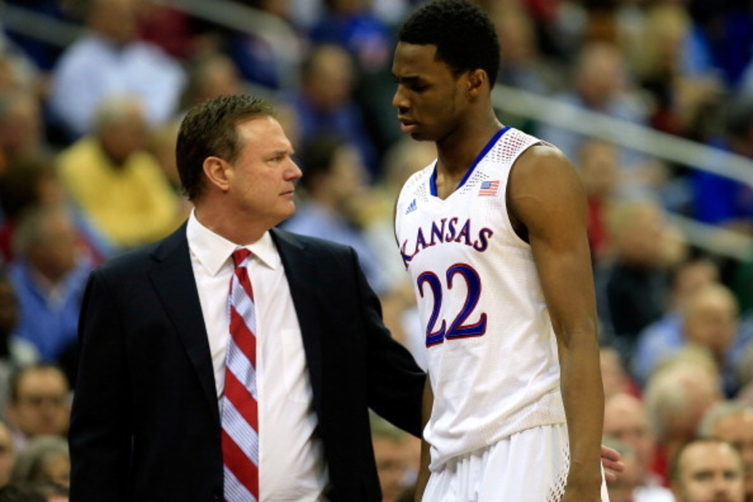 KANSAS CITY, MO - MARCH 14:  Andrew Wiggins #22 of the Kansas Jayhawks walks off the court past head coach Bill Self during the Big 12 Basketball Tournament semifinal game against the Iowa State Cyclones at Sprint Center on March 14, 2014 in Kansas City, 