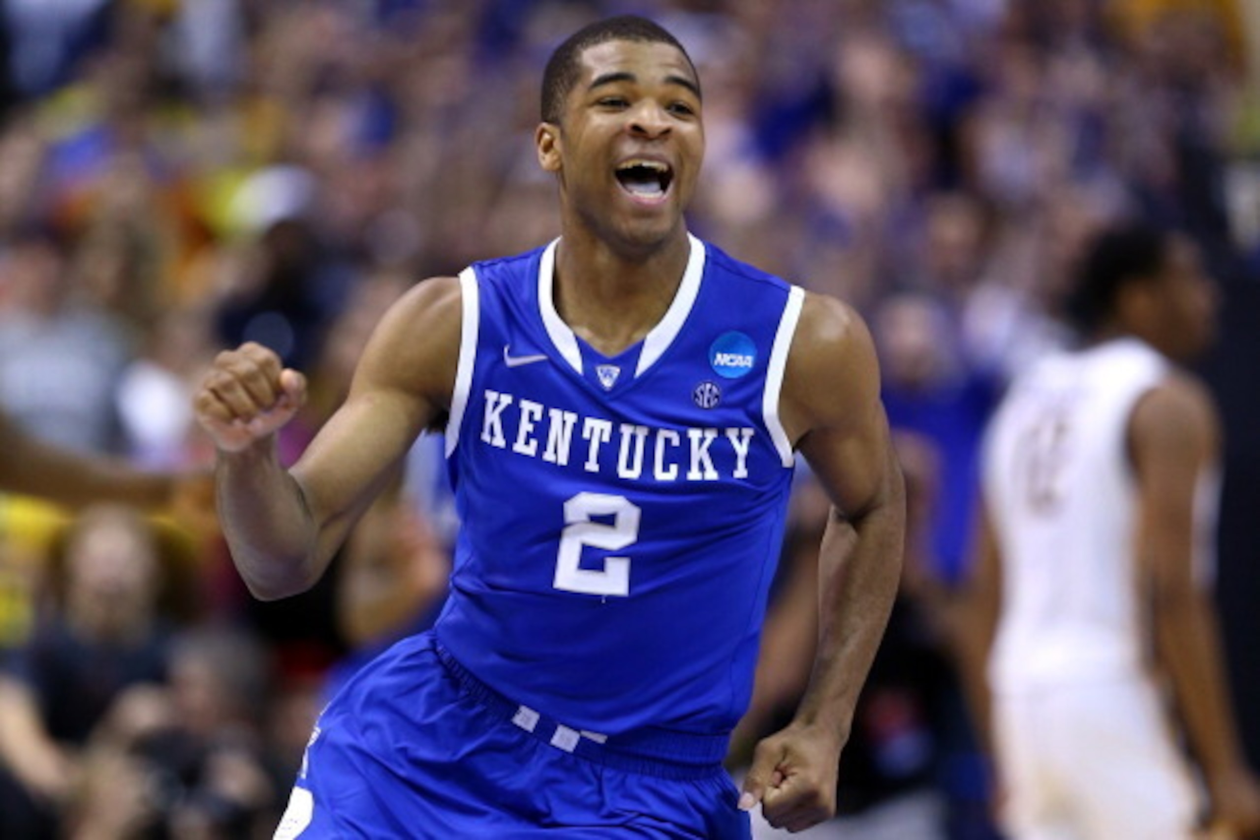 ST LOUIS, MO - MARCH 23:  Aaron Harrison #2 of the Kentucky Wildcats celebrates after defeating the Wichita State Shockers 78 to 76 during the third round of the 2014 NCAA Men's Basketball Tournament at Scottrade Center on March 23, 2014 in St Louis, Miss