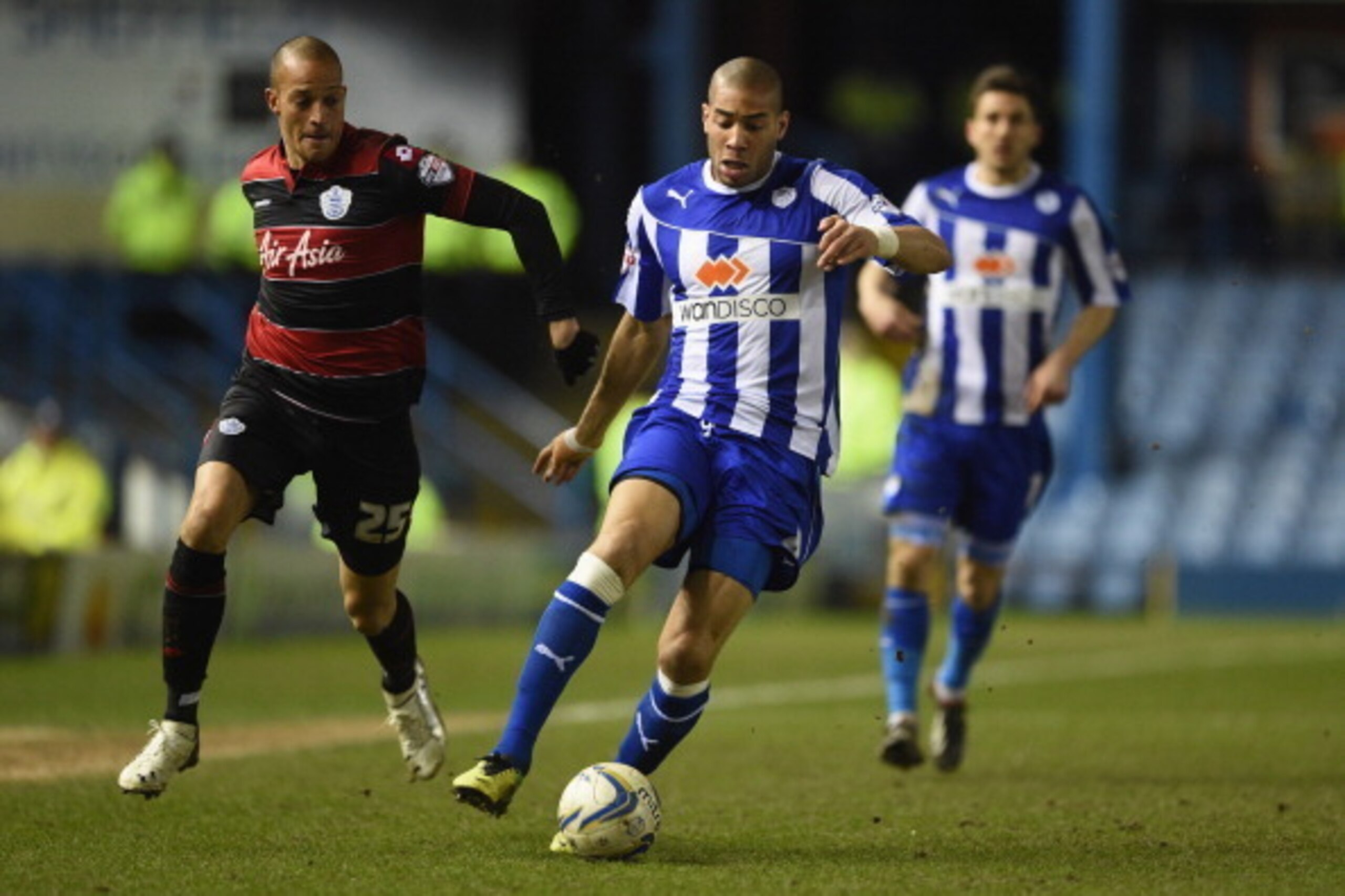 SHEFFIELD, ENGLAND - JANUARY 11: Bobby Zamora of QPR in action with Oguchi Onyewu of Sheffield Wednesday during the Sky Bet Championship match between Sheffield Wednesday and Leeds United at Hillsborough Stadium on January 11, 2014 in Sheffield, England, 