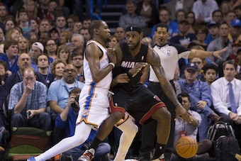 Oklahoma City, OK - February 20: LeBron James #6 of the Miami Heat drives to the basket against Kevin Durant #35 of the Oklahoma City Thunder at the Chesapeake Arena on February 20, 2014 in Oklahoma City, OK. NOTE TO USER:  User expressly acknowledges and