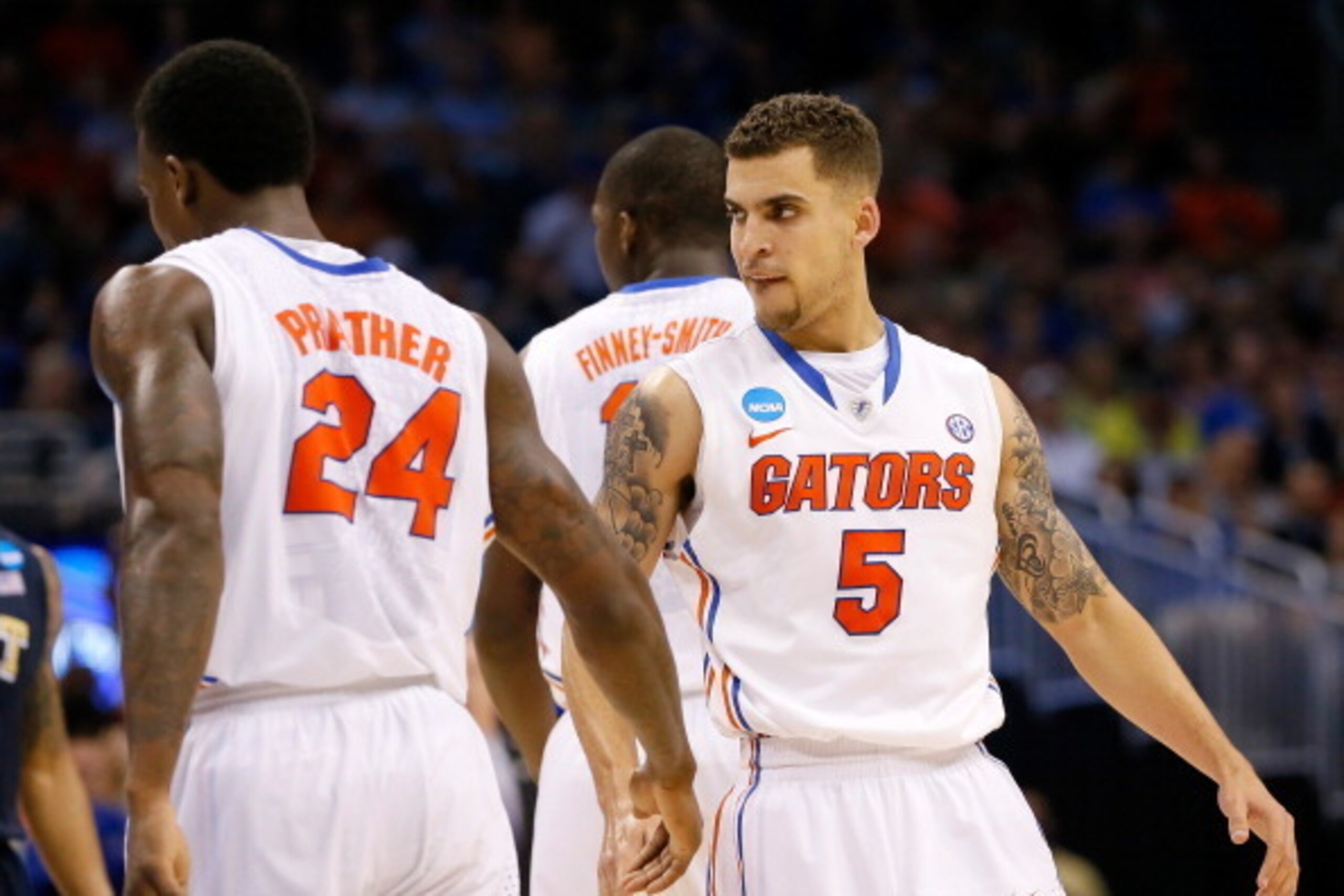 ORLANDO, FL - MARCH 22:  Scottie Wilbekin #5 of the Florida Gators reacts with Casey Prather #24 after making a three-pointer in the second half against the Pittsburgh Panthers in the second half during the third round of the 2014 NCAA Men's Basketball To