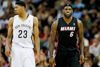 Mar 22, 2014; New Orleans, LA, USA; New Orleans Pelicans forward Anthony Davis (23) and Miami Heat forward LeBron James (6) during the second quarter of a game at the Smoothie King Center. Mandatory Credit: Derick E. Hingle-USA TODAY Sports