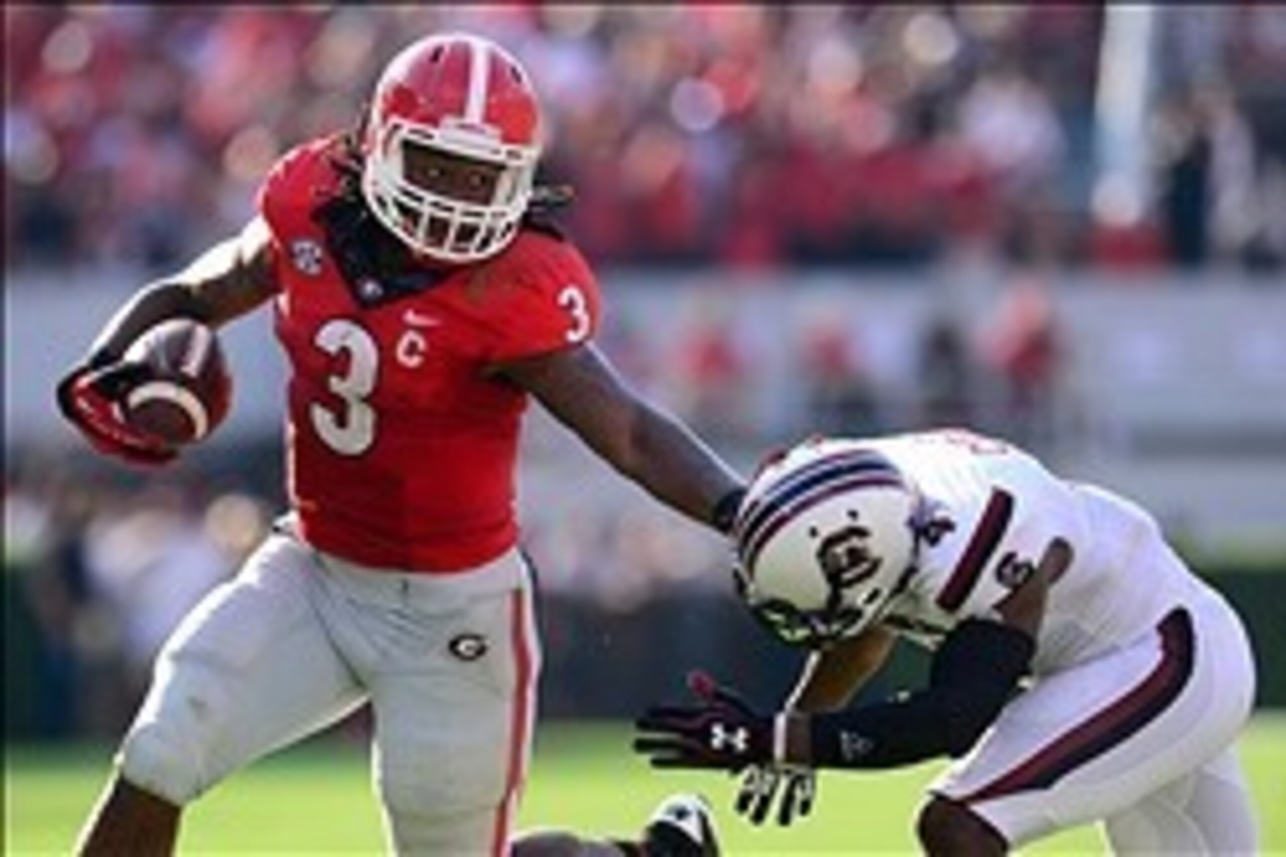 Sep 7, 2013; Athens, GA, USA; Georgia Bulldogs running back Todd Gurley (3) straight arms South Carolina Gamecocks cornerback Ahmad Christian (4) during the second quarter at Sanford Stadium. Mandatory Credit: Dale Zanine-USA TODAY Sports