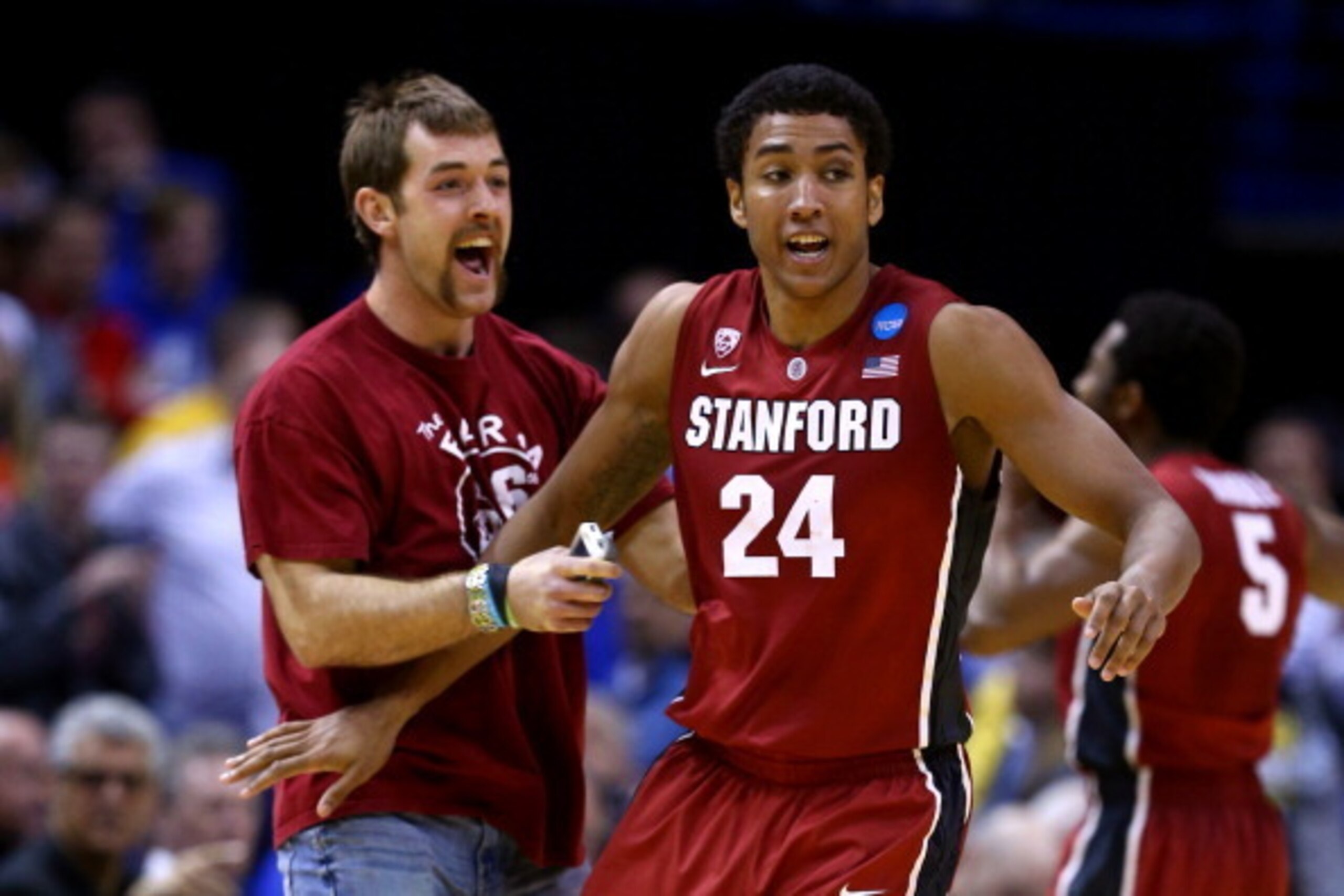 ST LOUIS, MO - MARCH 23:  Josh Huestis #24 of the Stanford Cardinal celebrates defeating the Kansas Jayhawks during the third round of the 2014 NCAA Men's Basketball Tournament at Scottrade Center on March 23, 2014 in St Louis, Missouri.  (Photo by Andy L