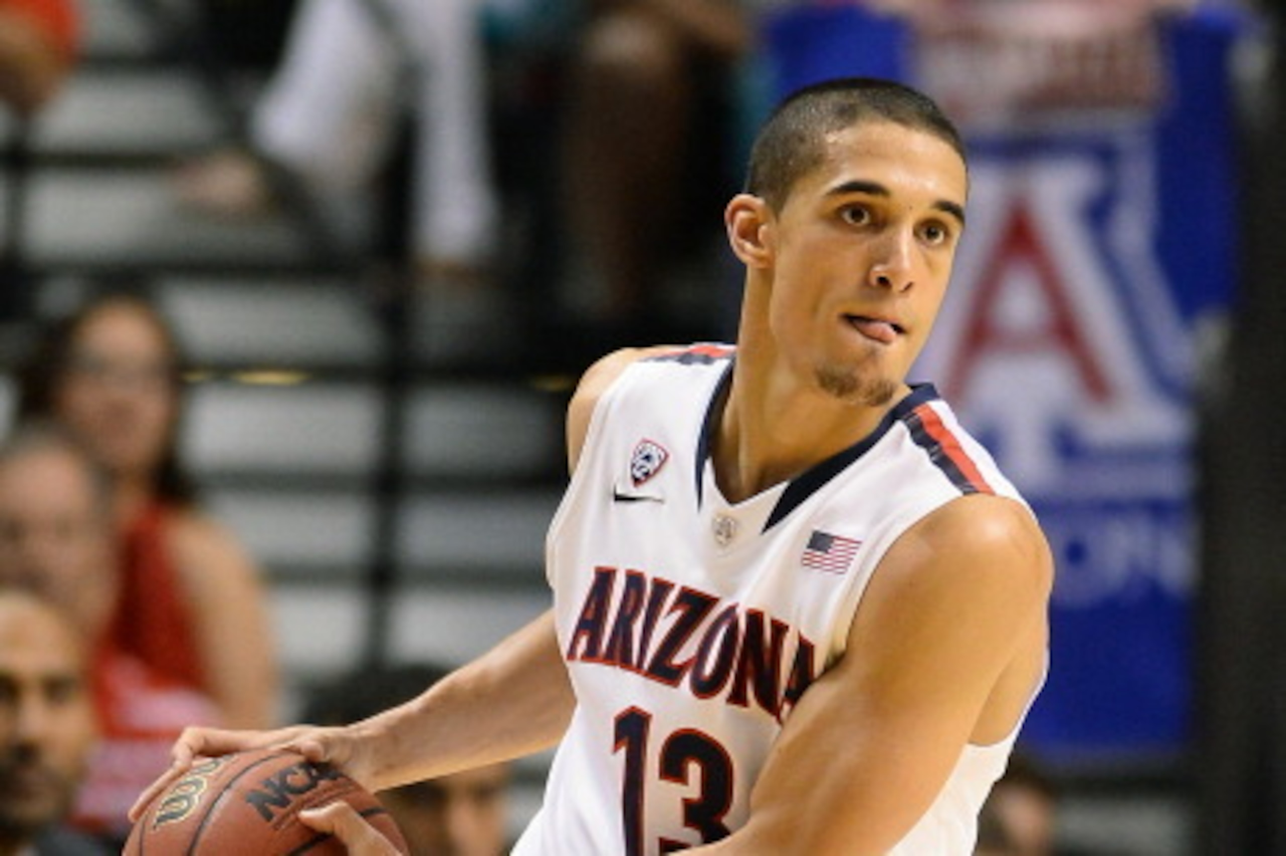 LAS VEGAS, NV - MARCH 15:  Nick Johnson #13 of the Arizona Wildcats looks to pass against the UCLA Bruins during the championship game of the Pac-12 Basketball Tournament at the MGM Grand Garden Arena on March 15, 2014 in Las Vegas, Nevada. UCLA won 75-71