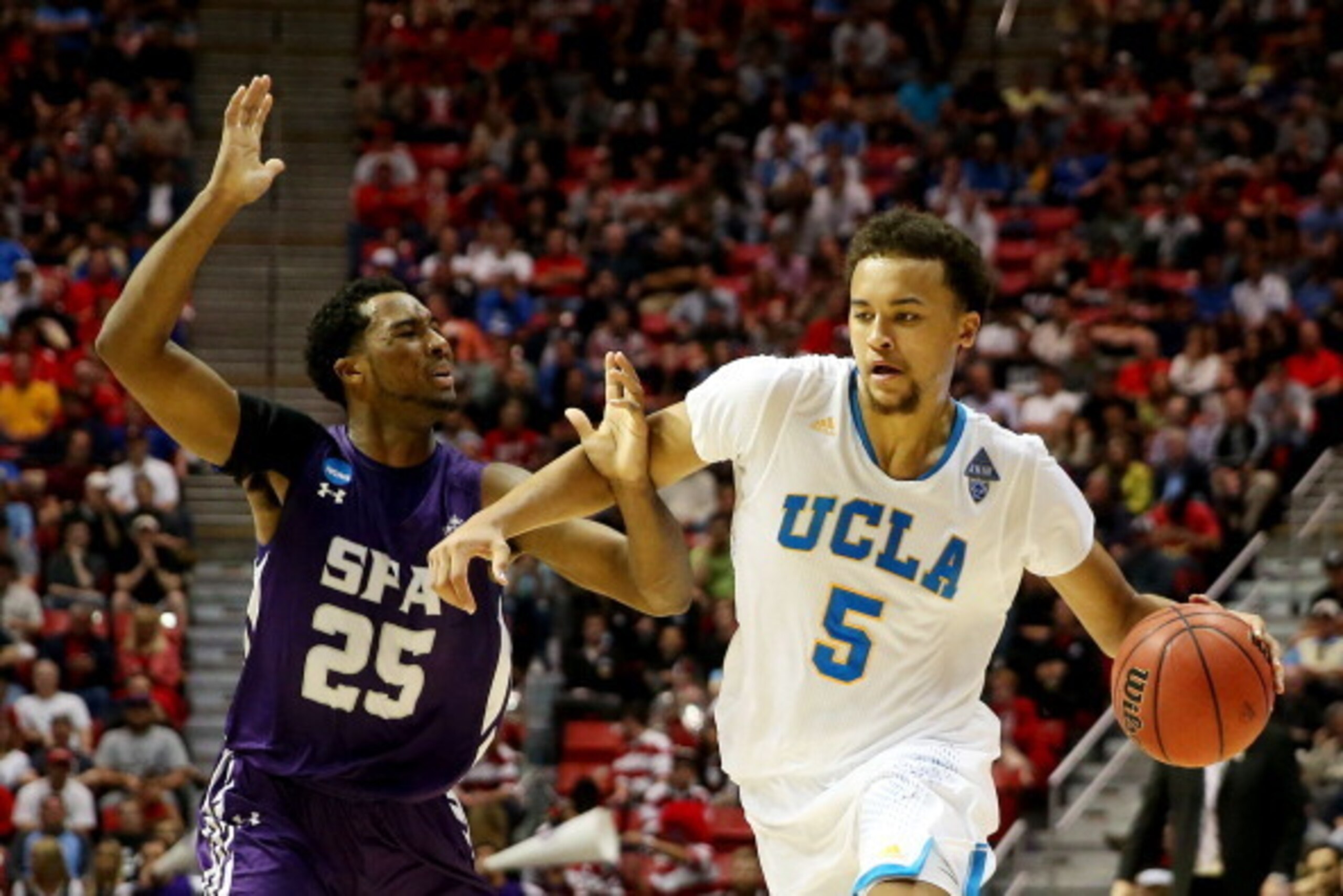 SAN DIEGO, CA - MARCH 23: Kyle Anderson #5 of the UCLA Bruins drives against Desmond Haymon #25 of the Stephen F. Austin Lumberjacks in the second half during the third round of the 2014 NCAA Men's Basketball Tournament at Viejas Arena on March 23, 2014 SAN DIEGO, CA - MARCH 23: Kyle Anderson #5 of the UCLA Bruins drives against Desmond Haymon #25 of the Stephen F. Austin Lumberjacks in the second half during the third round of the 2014 NCAA Men's Basketball Tournament at Viejas Arena on March 23, 2014