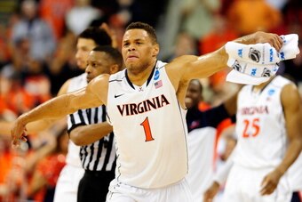 RALEIGH, NC - MARCH 23:  Justin Anderson #1 of the Virginia Cavaliers celebrates late in the game against the Memphis Tigers during the third round of the 2014 NCAA Men's Basketball Tournament at PNC Arena on March 23, 2014 in Raleigh, North Carolina.  (P