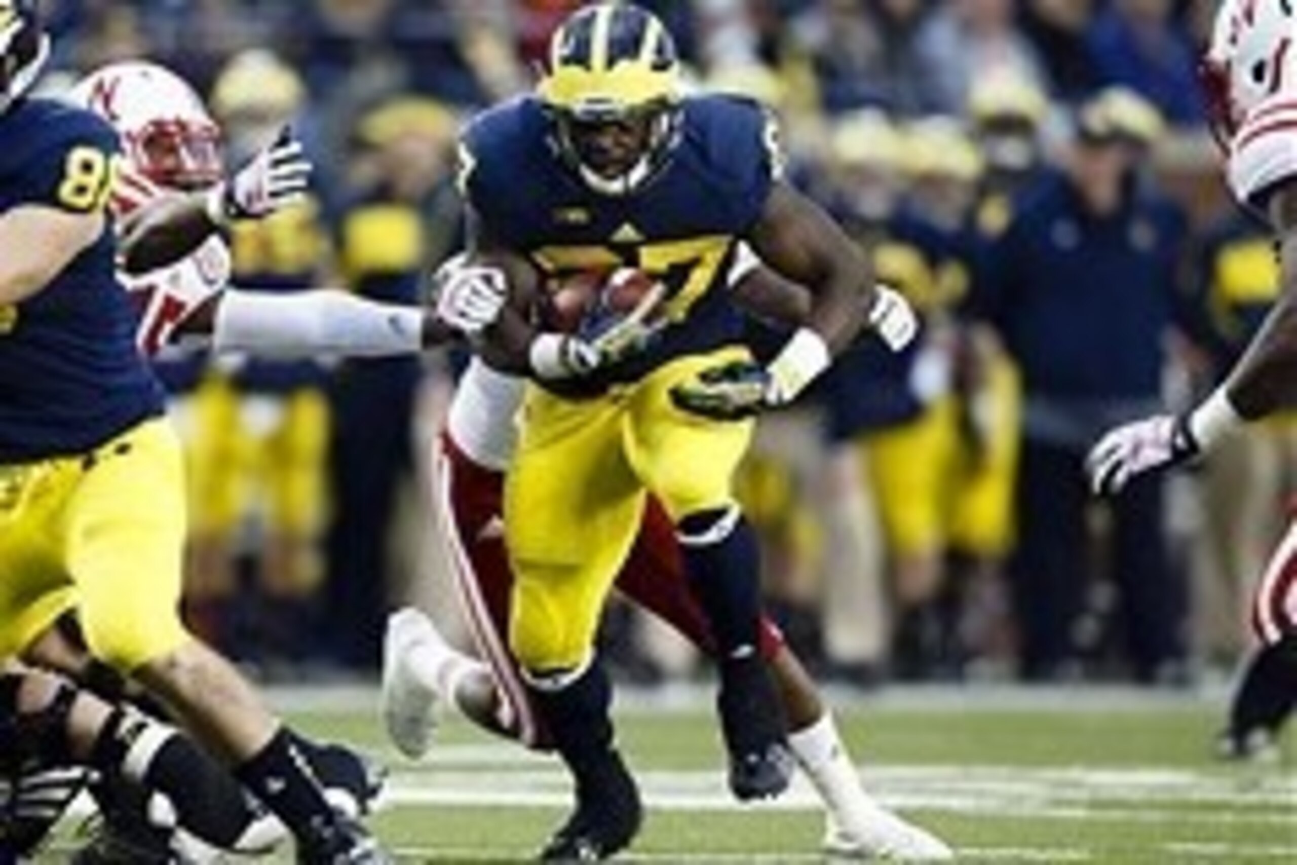 Nov 9, 2013; Ann Arbor, MI, USA; Michigan Wolverines running back Derrick Green (27) runs the ball against the Nebraska Cornhuskers in the second quarter at Michigan Stadium. Mandatory Credit: Rick Osentoski-USA TODAY Sports Nov 9, 2013; Ann Arbor, MI, USA; Michigan Wolverines running back Derrick Green (27) runs the ball against the Nebraska Cornhuskers in the second quarter at Michigan Stadium. Mandatory Credit: Rick Osentoski-USA TODAY Sports