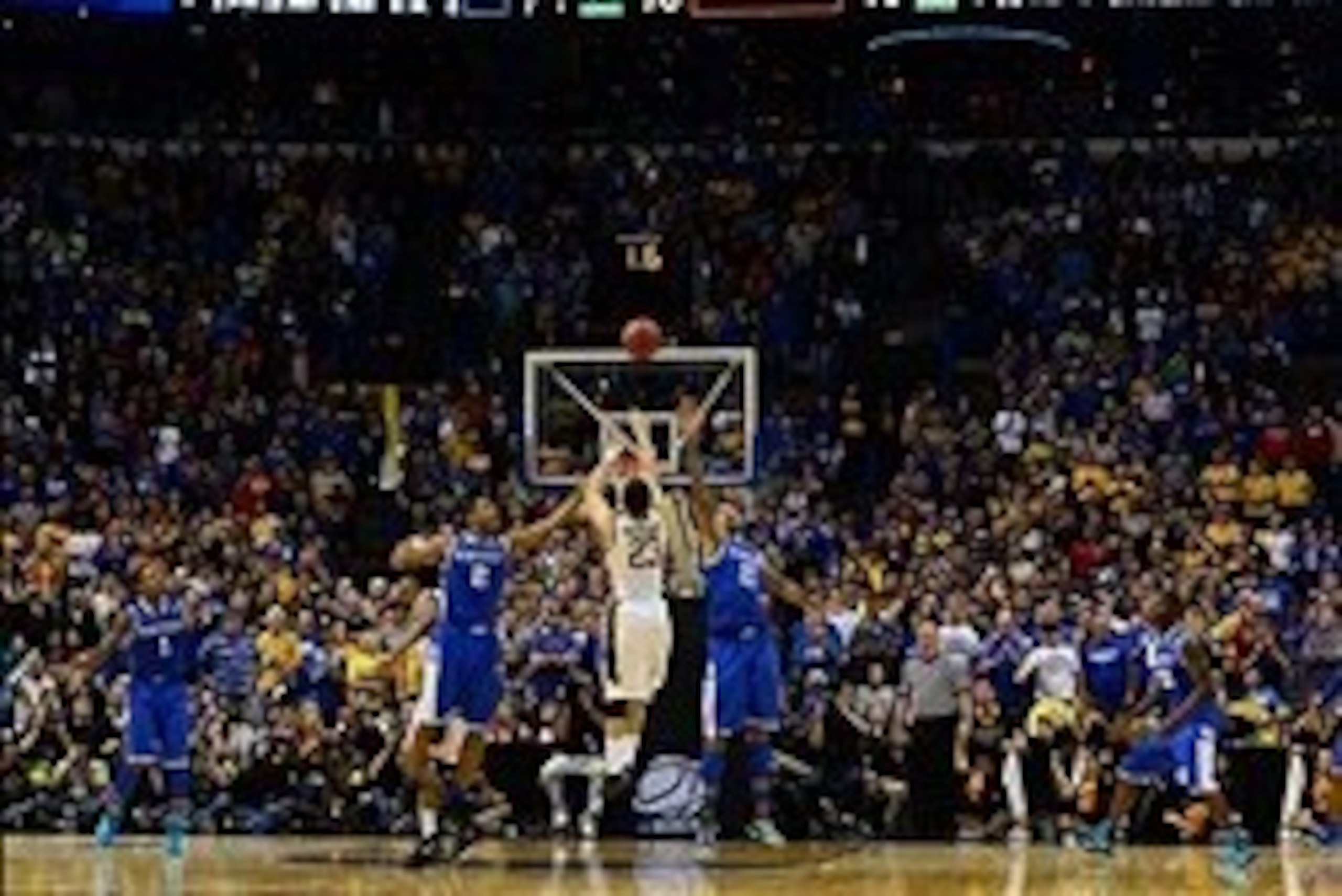 Mar 23, 2014; St. Louis, MO, USA; Wichita State Shockers guard Fred VanVleet (23) misses a three-point shot with 1.6 remaining defended by Kentucky Wildcats forward Willie Cauley-Stein (15) and Aaron Harrison (2) during the second half in the third round 