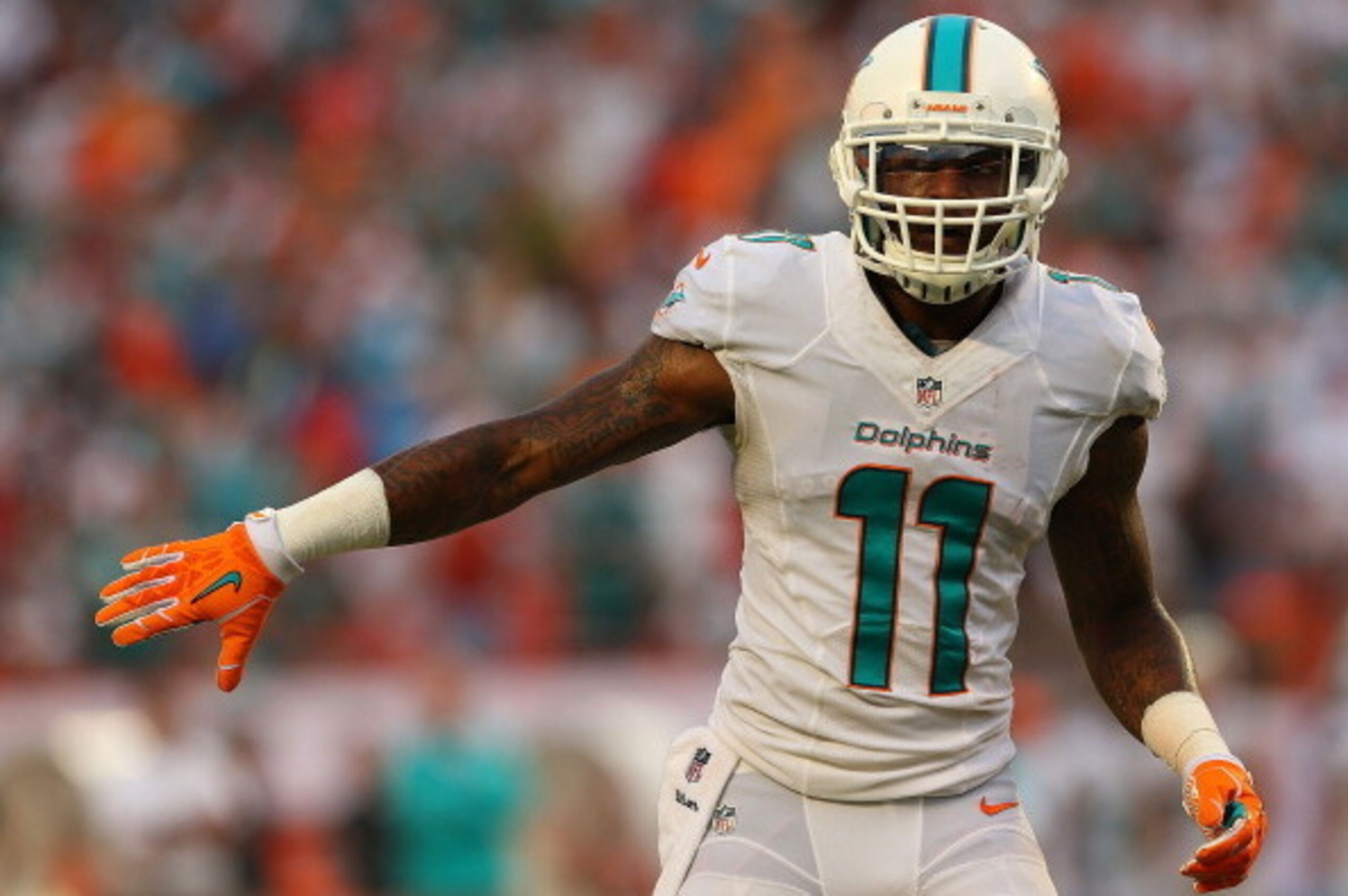 MIAMI GARDENS, FL - SEPTEMBER 22: Mike Wallace #11 of the Miami Dolphins looks on during a game  against the Atlanta Falcons at Sun Life Stadium on September 22, 2013 in Miami Gardens, Florida.  (Photo by Mike Ehrmann/Getty Images)