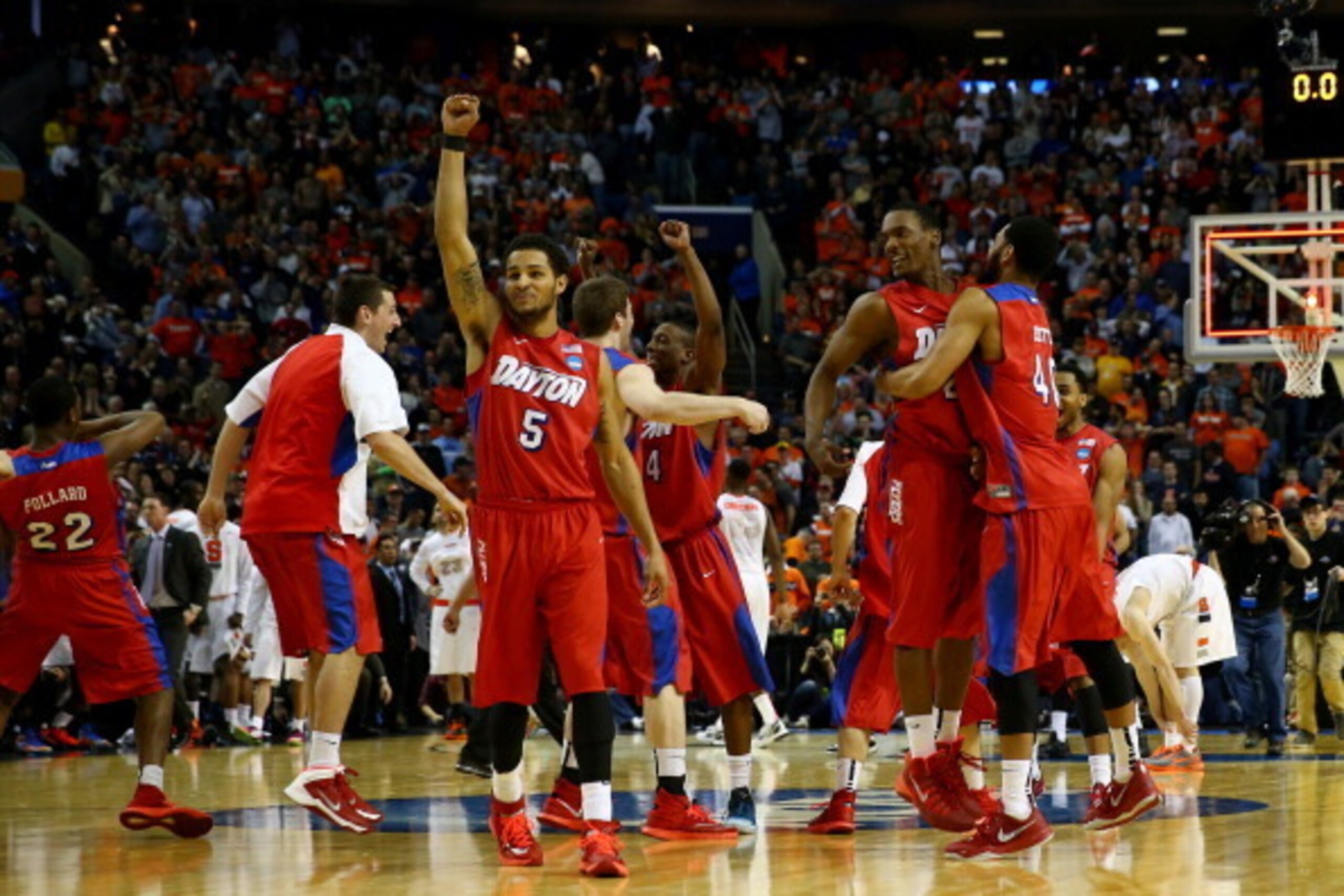 BUFFALO, NY - MARCH 22:  Devin Oliver #5 of the Dayton Flyers reacts after defeating the Syracuse Orange 55-53 in the third round of the 2014 NCAA Men's Basketball Tournament at the First Niagara Center on March 22, 2014 in Buffalo, New York.  (Photo by E