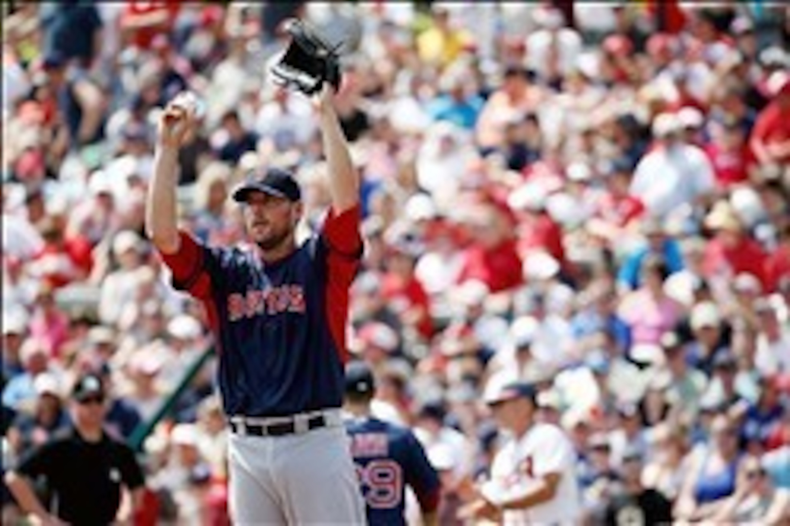 Mar 22, 2014; Lake Buena Vista, FL, USA; Boston Red Sox starting pitcher John Lackey (41) reacts after a play during the game against the Atlanta Braves at Champion Stadium. Mandatory Credit: Rob Foldy-USA TODAY Sports