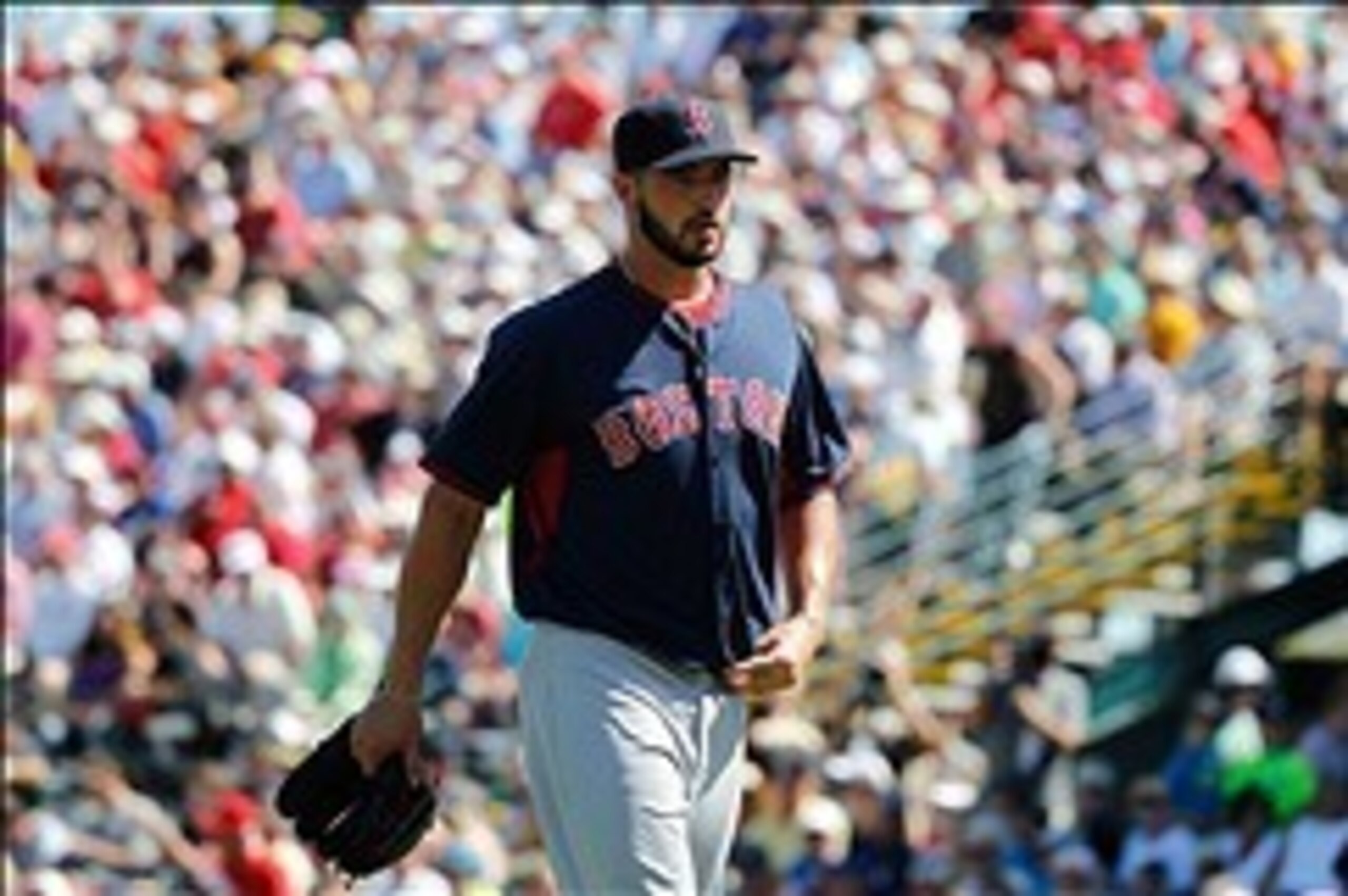 Mar 3, 2014; Bradenton, FL, USA; Boston Red Sox relief pitcher Brandon Workman (67) walks back to the dugout after he pitched the first inning against the Pittsburgh Pirates at McKechnie Field. Mandatory Credit: Kim Klement-USA TODAY Sports