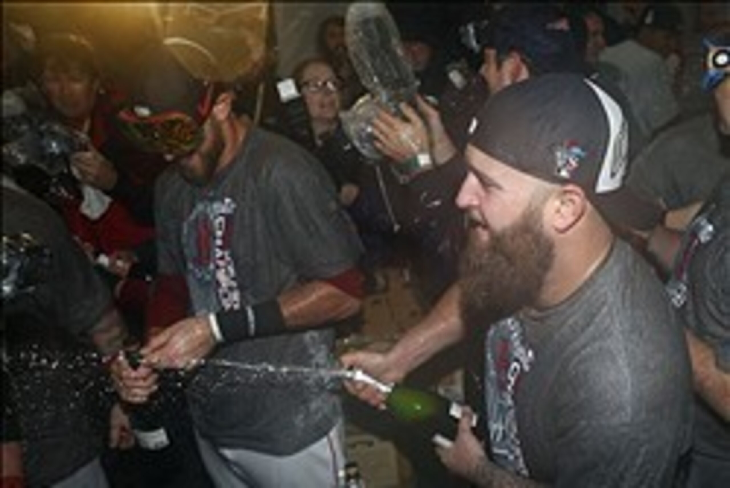Oct 30, 2013; Boston, MA, USA; Boston Red Sox first baseman Mike Napoli (center) celebrates with teammates after winning game six of the MLB baseball World Series at Fenway Park. Red Sox won 6-1. Mandatory Credit: Greg M. Cooper-USA TODAY Sports