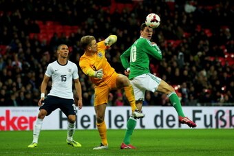 LONDON, ENGLAND - NOVEMBER 19:  Julian Draxler of Germany beats Joe Hart of England to the ball during the international friendly match between England and Germany at Wembley Stadium on November 19, 2013 in London, England.  (Photo by Clive Rose/Getty Ima