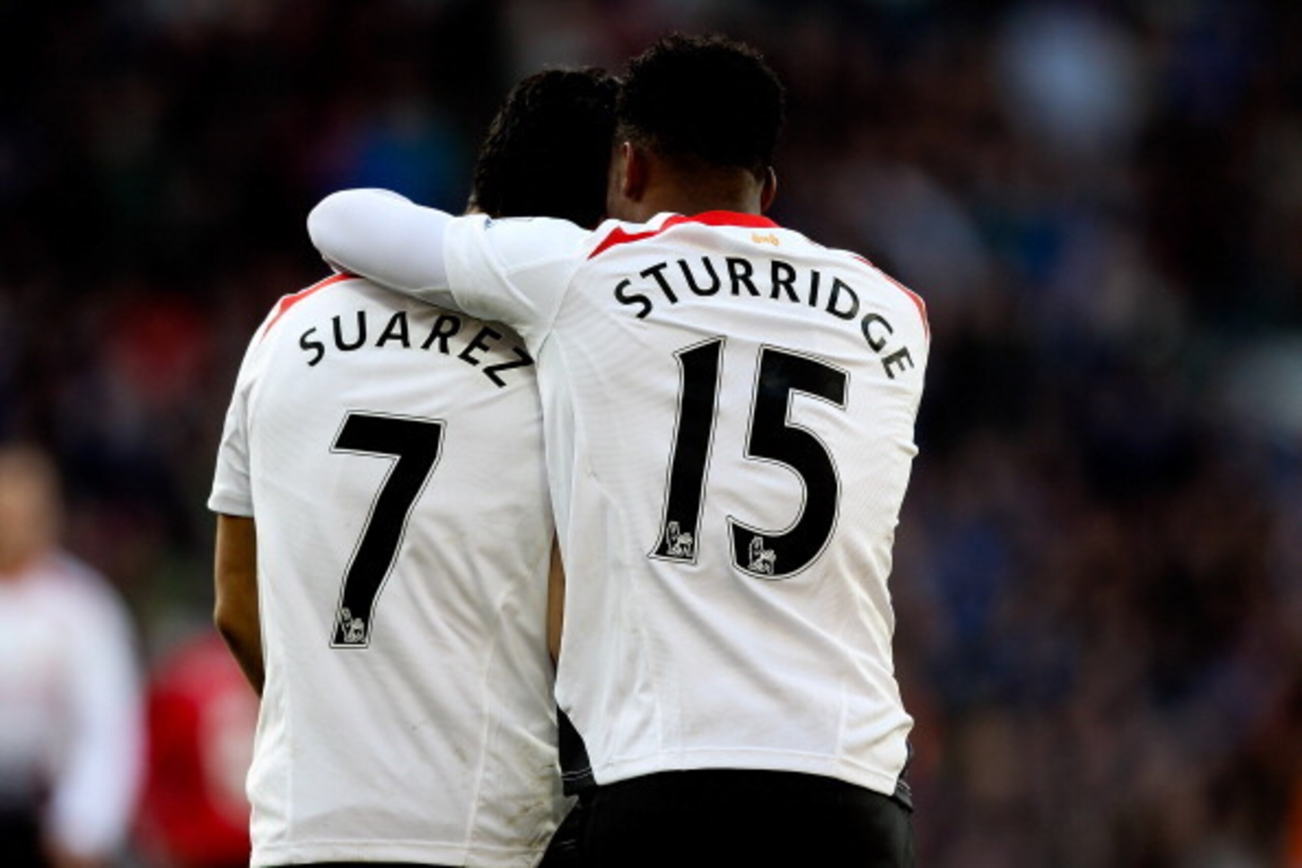 CARDIFF, WALES - MARCH 22:  Daniel Sturridge of Liverpool celebrates with team mate Luis Suarez after scoring his team's fifth goal during the Barclays Premier League match between Cardiff City and Liverpool at Cardiff City Stadium on March 22, 2014 in Ca