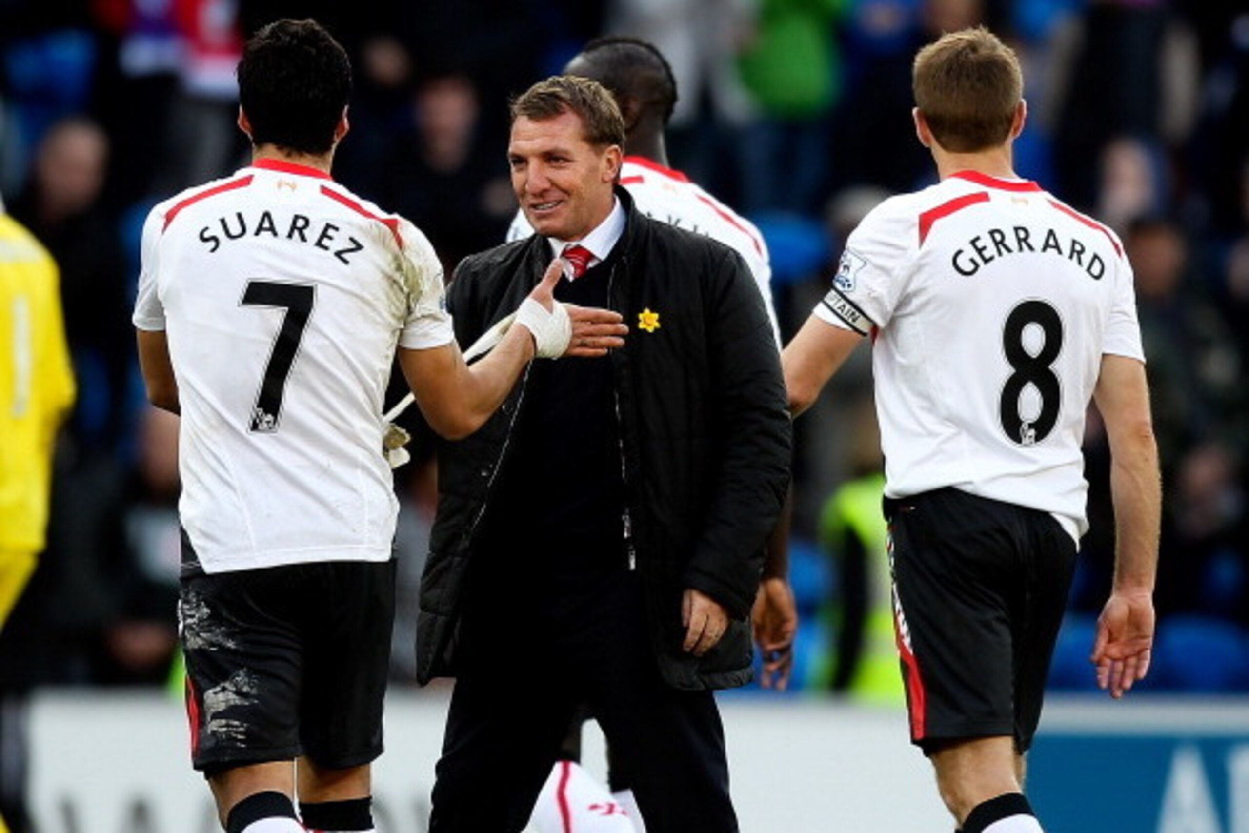 CARDIFF, WALES - MARCH 22: Luis Suarez of Liverpool is congratulated by his manager Brendan Rogers after the final whistle during the Barclays Premier League match between Cardiff City and Liverpool at Cardiff City Stadium on March 22, 2014 in Cardiff, Wa