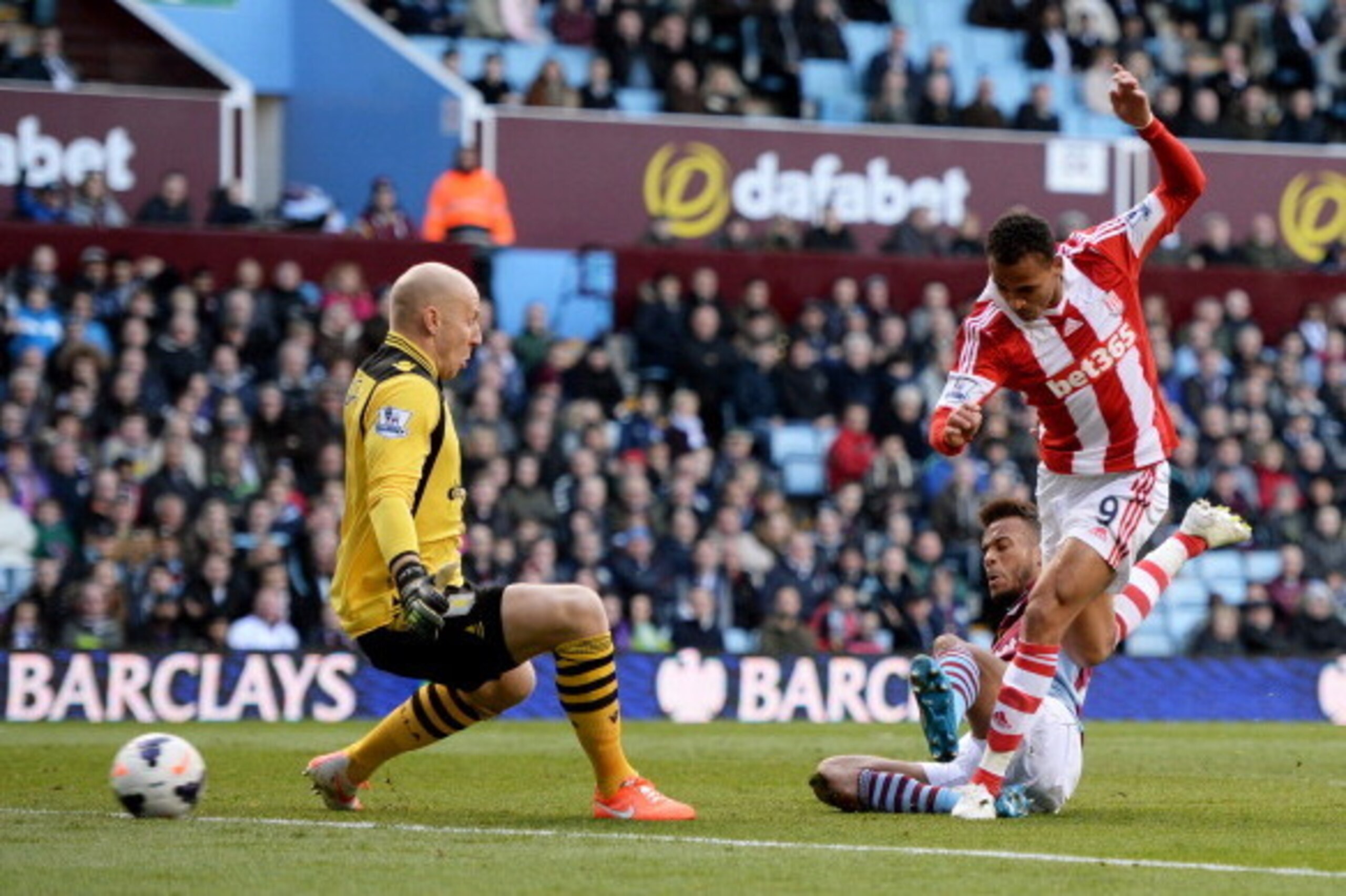 BIRMINGHAM, ENGLAND - MARCH 23:  Peter Odemwingie of Stoke shoots past goalkeeper Brad Guzan of Aston Villa to score a goal to level the scores at 1-1 during the Barclays Premier League match between Aston Villa and Stoke City at Villa Park on March 23, 2