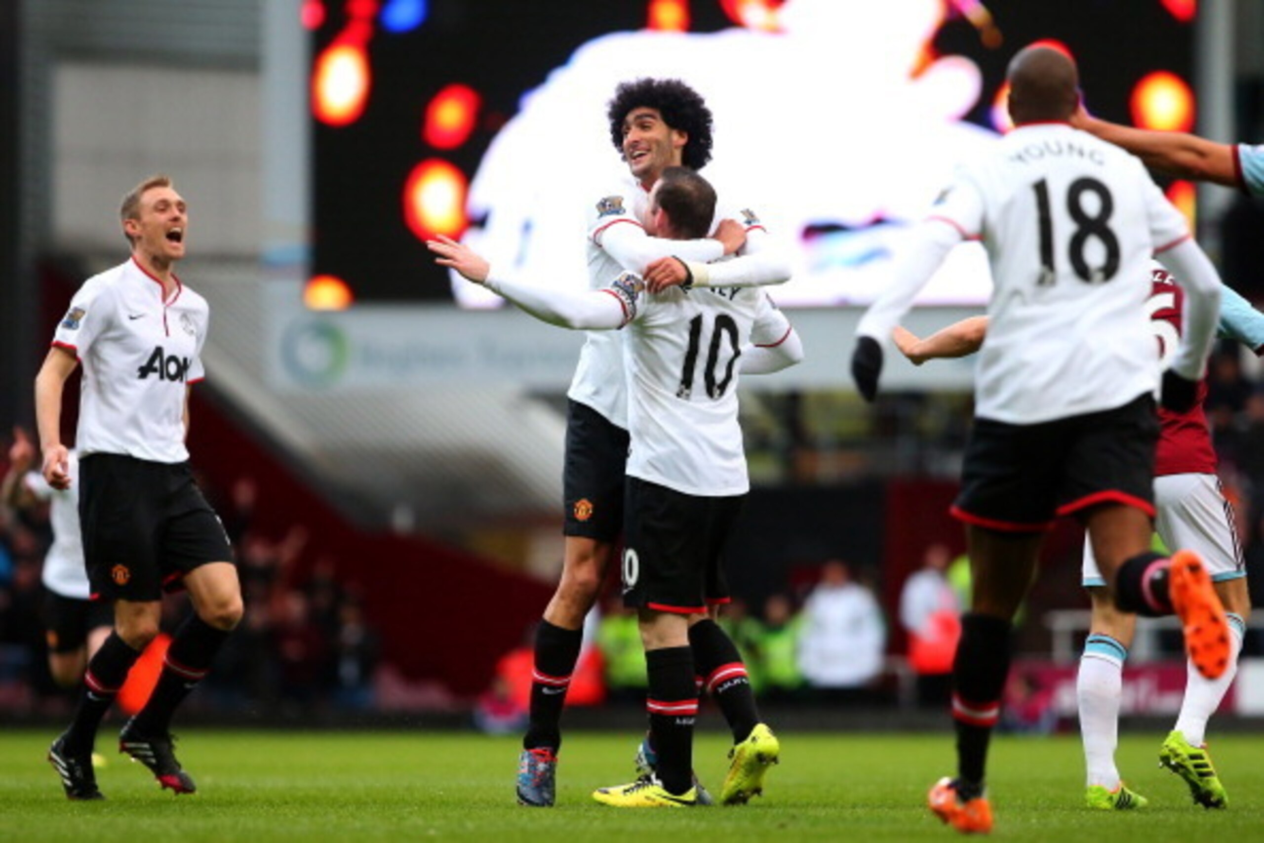 LONDON, ENGLAND - MARCH 22:  Wayne Rooney of Manchester United is congratulated by teammate Marouane Fellaini of Manchester United after scoring the opening goal with a long range shot during the Barclays Premier League match between West Ham United and M