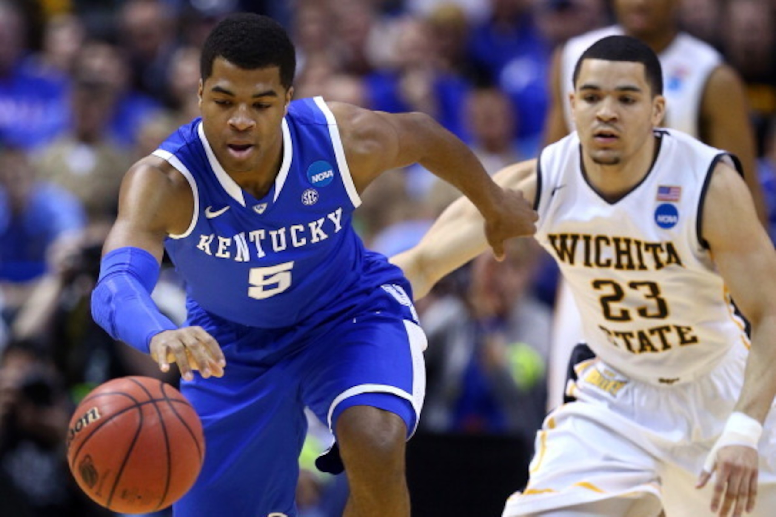 ST LOUIS, MO - MARCH 23: Andrew Harrison #5 of the Kentucky Wildcats drives up the court against Fred VanVleet #23 of the Wichita State Shockers during the third round of the 2014 NCAA Men's Basketball Tournament at Scottrade Center on March 23, 2014 in S ST LOUIS, MO - MARCH 23: Andrew Harrison #5 of the Kentucky Wildcats drives up the court against Fred VanVleet #23 of the Wichita State Shockers during the third round of the 2014 NCAA Men's Basketball Tournament at Scottrade Center on March 23, 2014 in S