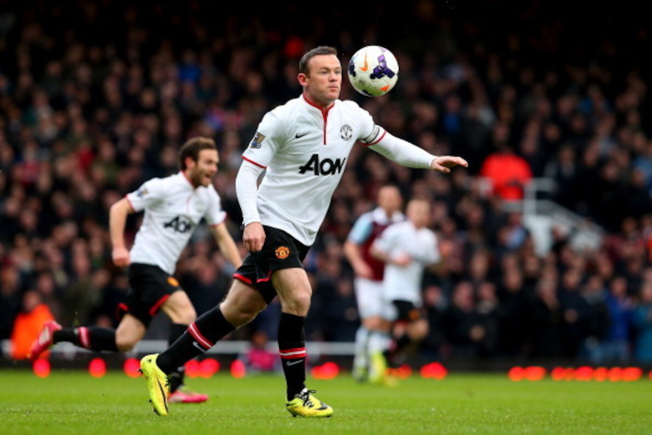 LONDON, ENGLAND - MARCH 22:  Wayne Rooney of Manchester United scores the opening goal with a long range shot during the Barclays Premier League match between West Ham United and Manchester United at Boleyn Ground on March 22, 2014 in London, England.  (P
