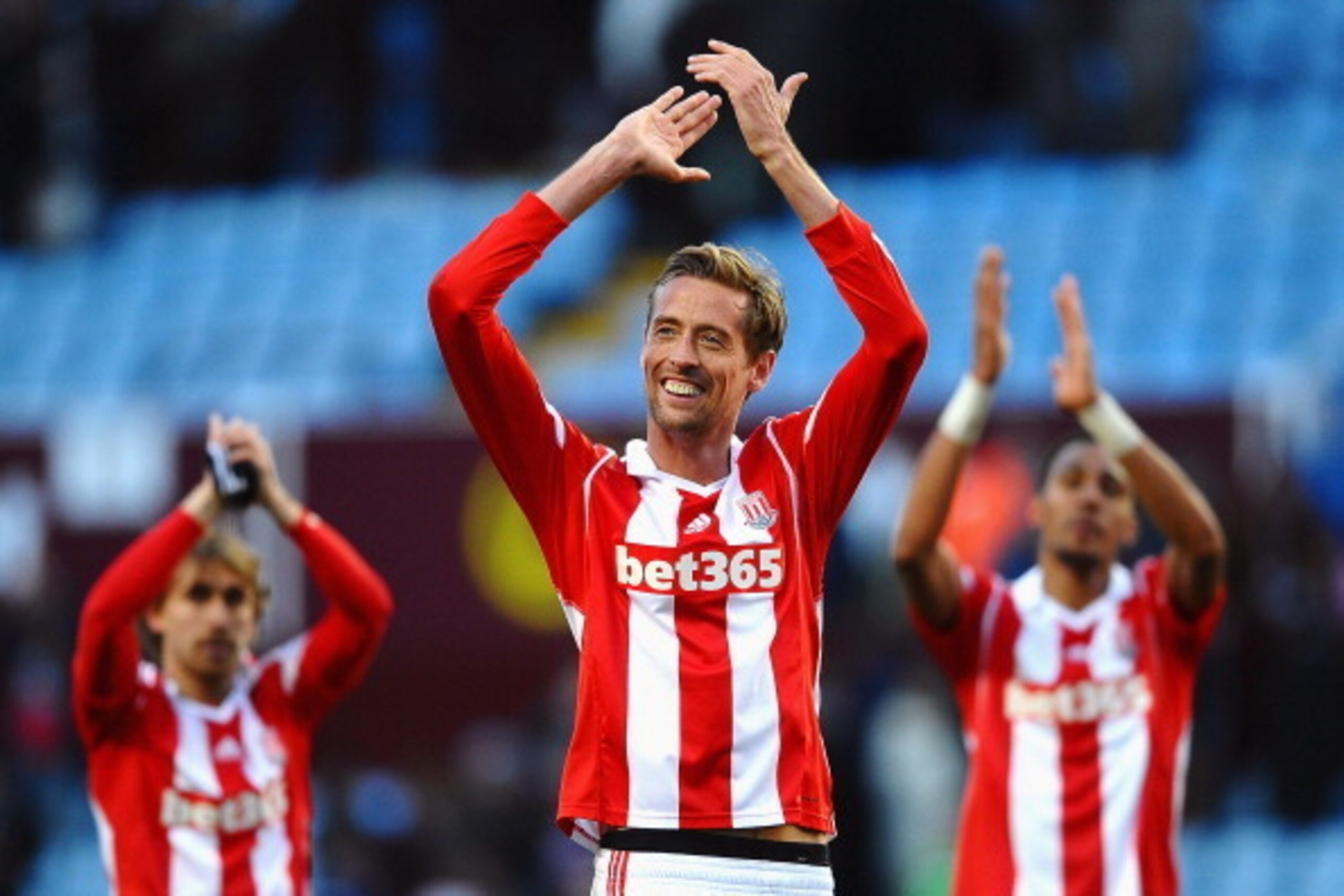 BIRMINGHAM, ENGLAND - MARCH 23:  Peter Crouch (C) of Stoke and teammates celebrate following their team's 4-2 victory during the Barclays Premier League match between Aston Villa and Stoke City at Villa Park on March 23, 2014 in Birmingham, England.  (Pho