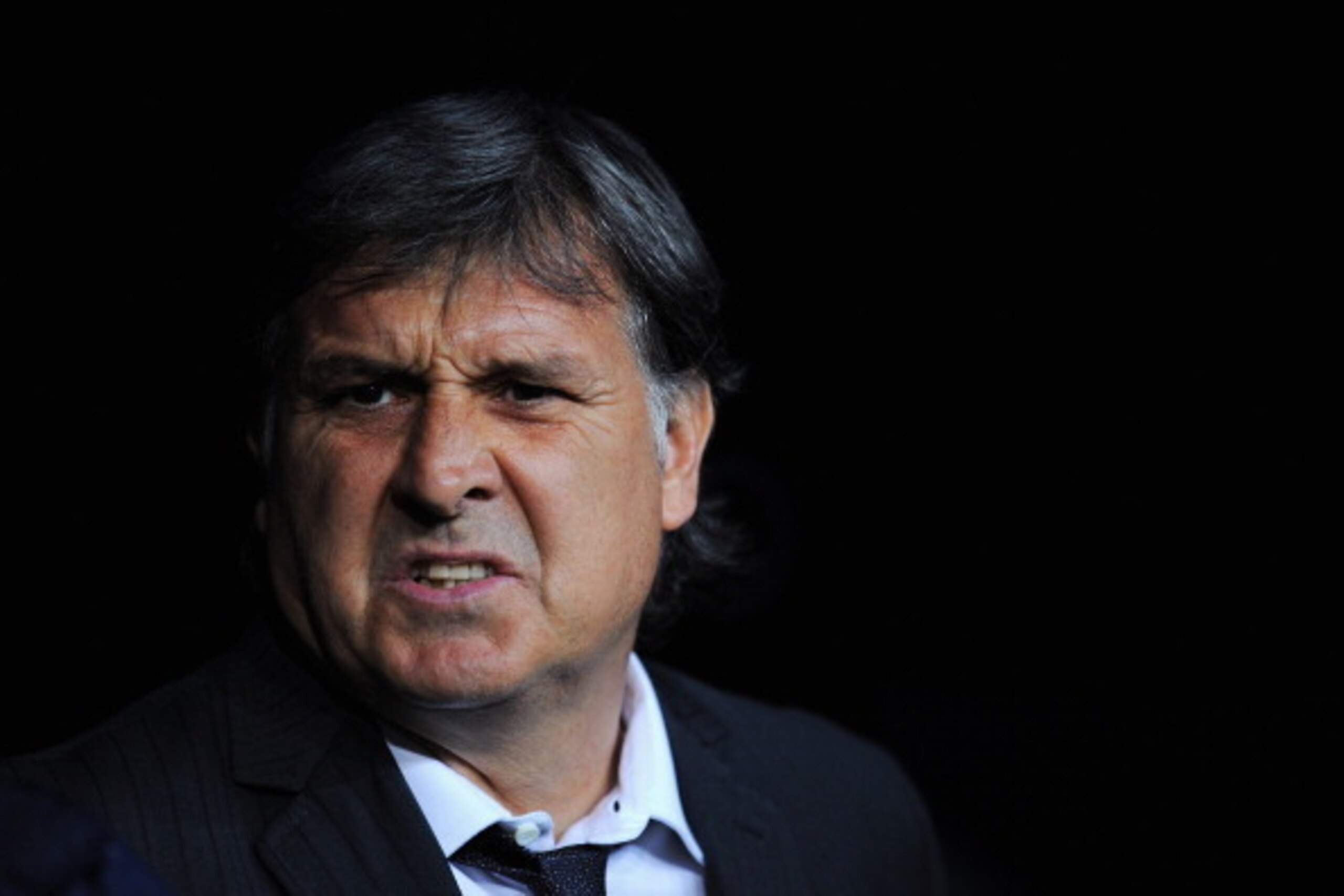 MADRID, SPAIN - MARCH 23: Gerardo Martino, coach of Barcelona looks on during the La Liga match between Real Madrid CF and FC Barcelona at the Bernabeu on March 23, 2014 in Madrid, Spain.  (Photo by Denis Doyle/Getty Images)