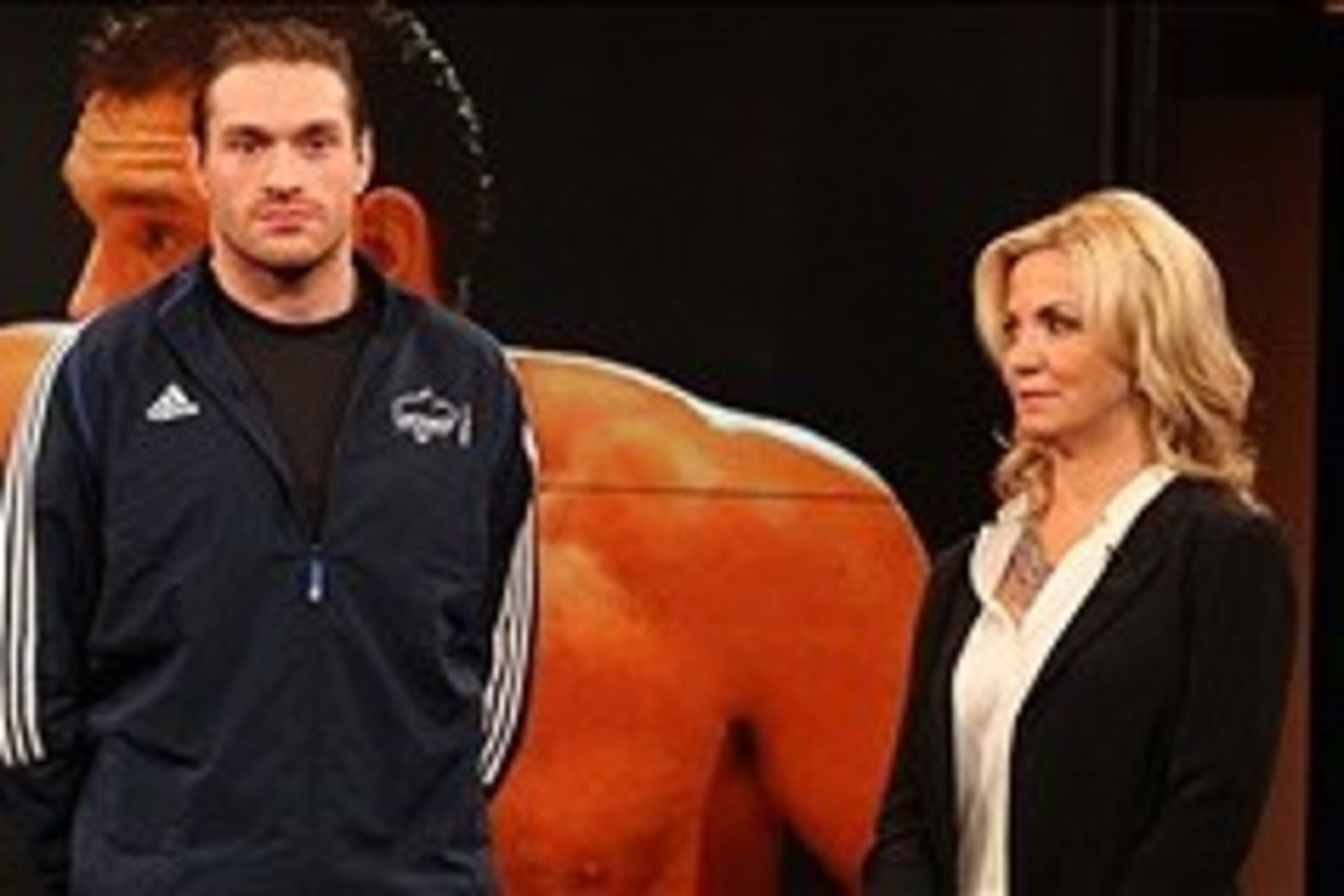 Apr 19, 2013; New York, NY, USA; Tyson Fury stands alongside Michelle Beadle on the set of the NBC Sports television show The Crossover. Mandatory Credit: Ed Mulholland-USA TODAY Sports