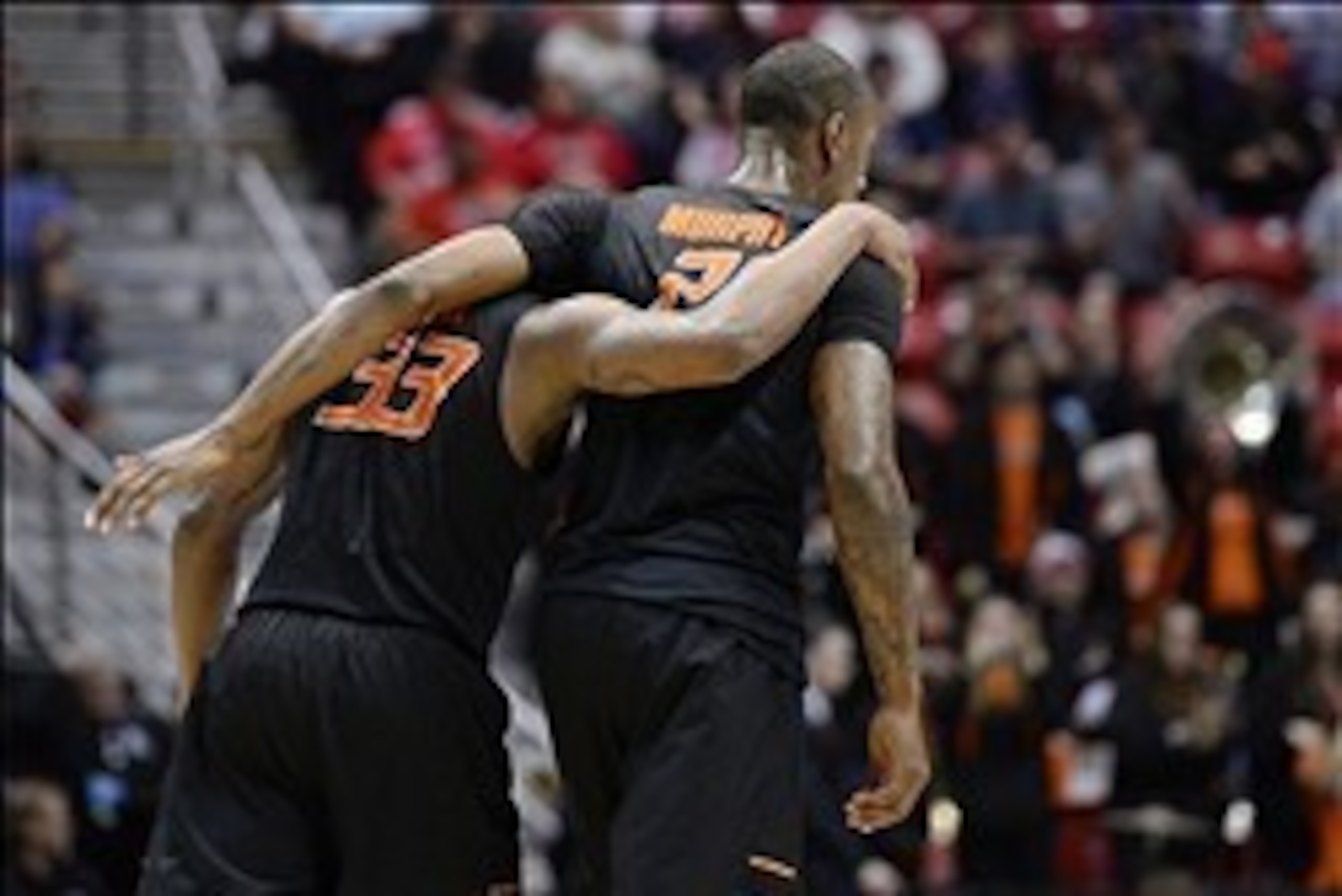 Mar 21, 2014; San Diego, CA, USA; Oklahoma State Cowboys guard Marcus Smart (33) and forward/center Kamari Murphy (21) head for the bench in the second half of a men's college basketball game during the second round of the 2014 NCAA Tournament against the