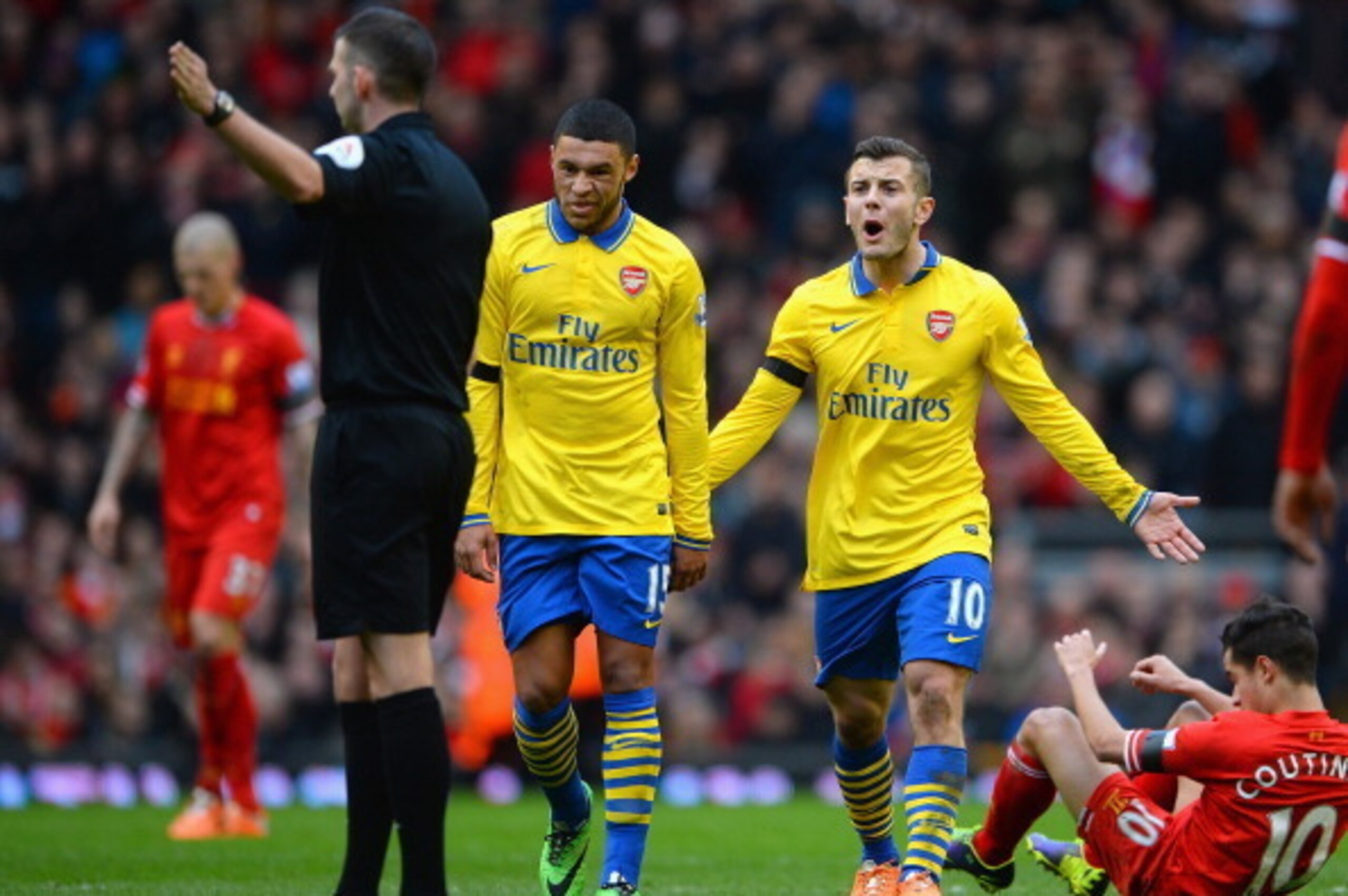 LIVERPOOL, ENGLAND - FEBRUARY 08:  Jack Wilshere of Arsenal reacts to Referee Michael Oliver during the Barclays Premier League match between Liverpool and Arsenal at Anfield on February 8, 2014 in Liverpool, England.  (Photo by Michael Regan/Getty Images