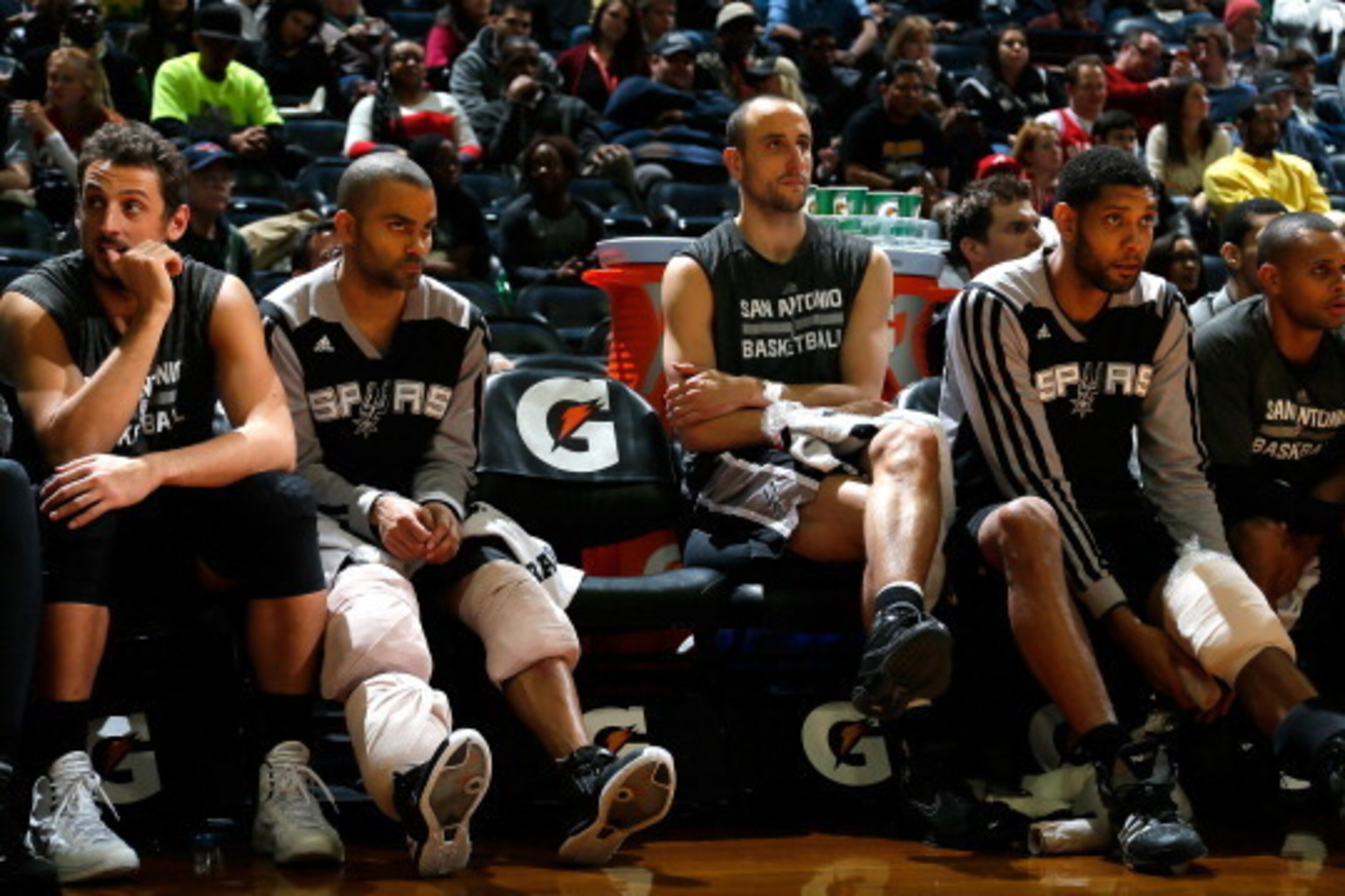 ATLANTA, GA - JANUARY 24:  Marco Belinelli #3, Tony Parker #9, Manu Ginobili #20, Tim Duncan #21 and Patty Mills #8 of the San Antonio Spurs sit on the bench in the final minutes of their 105-79 win over the Atlanta Hawks at Philips Arena on January 24, 2