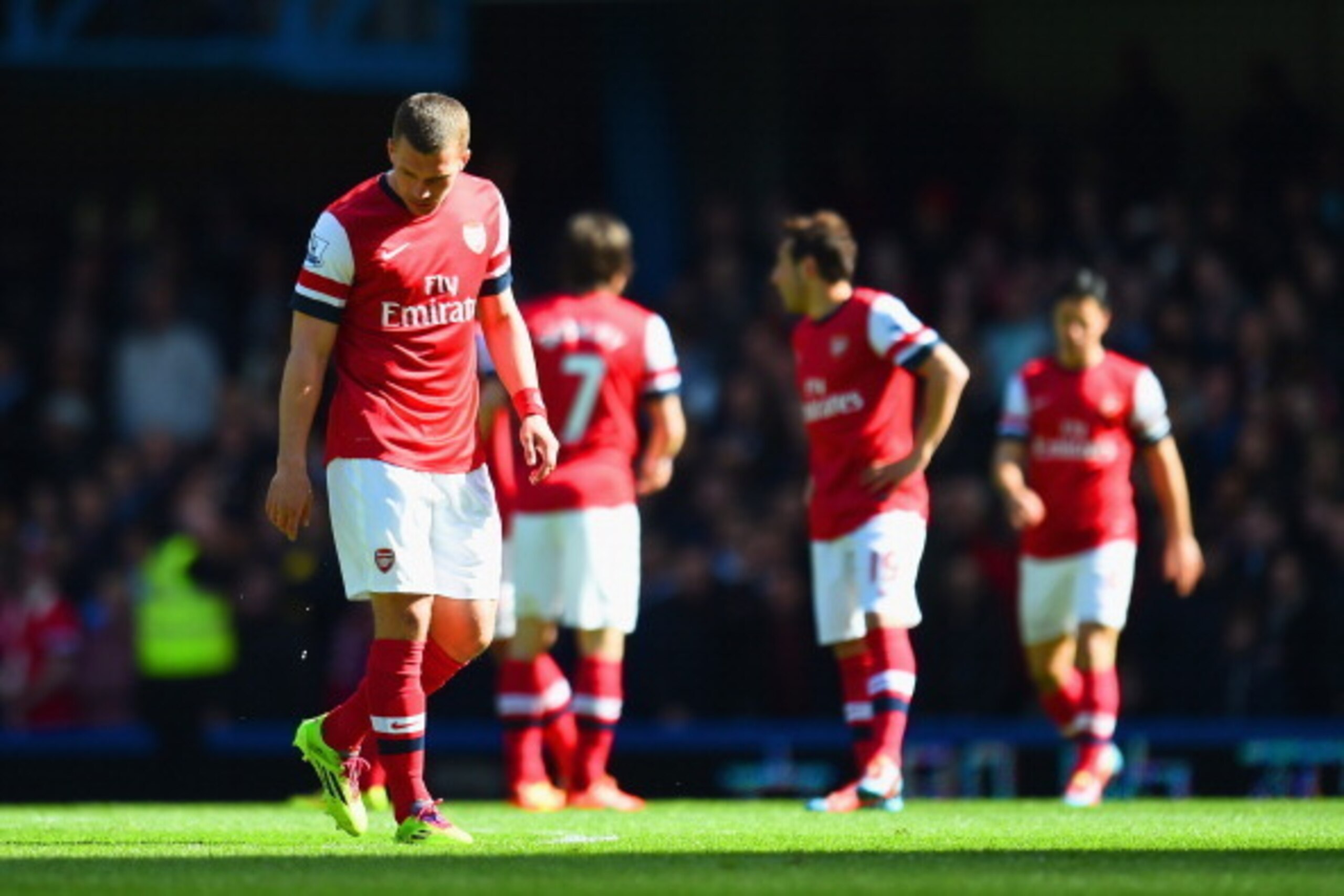 LONDON, ENGLAND - MARCH 22:  A dejected Lukas Podolski of Arsenal looks to the ground during the Barclays Premier League match between Chelsea and Arsenal at Stamford Bridge on March 22, 2014 in London, England.  (Photo by Shaun Botterill/Getty Images)