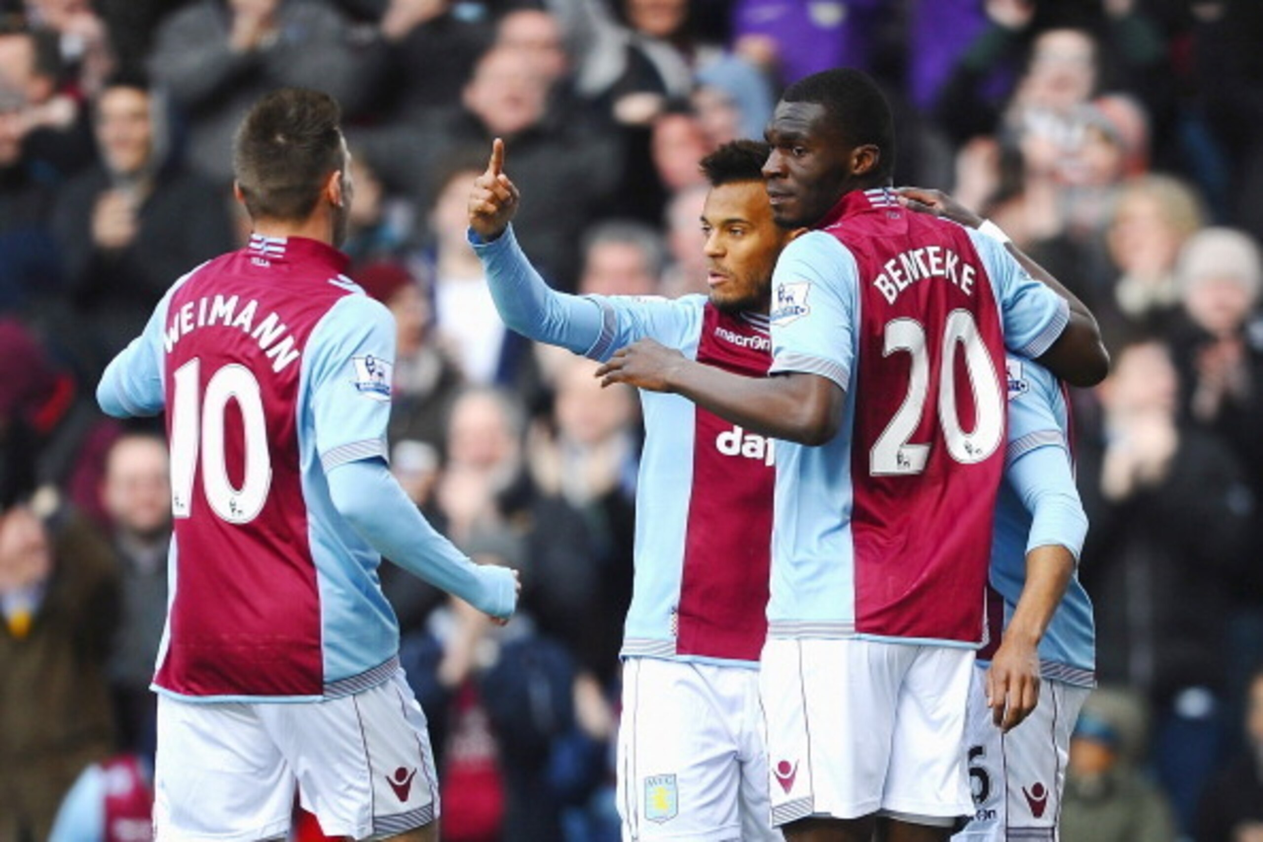 BIRMINGHAM, ENGLAND - MARCH 23:  Christian Benteke #20 (R) of Aston Villa celebrates with teammates after scoring the opening goal during the Barclays Premier League match between Aston Villa and Stoke City at Villa Park on March 23, 2014 in Birmingham, E